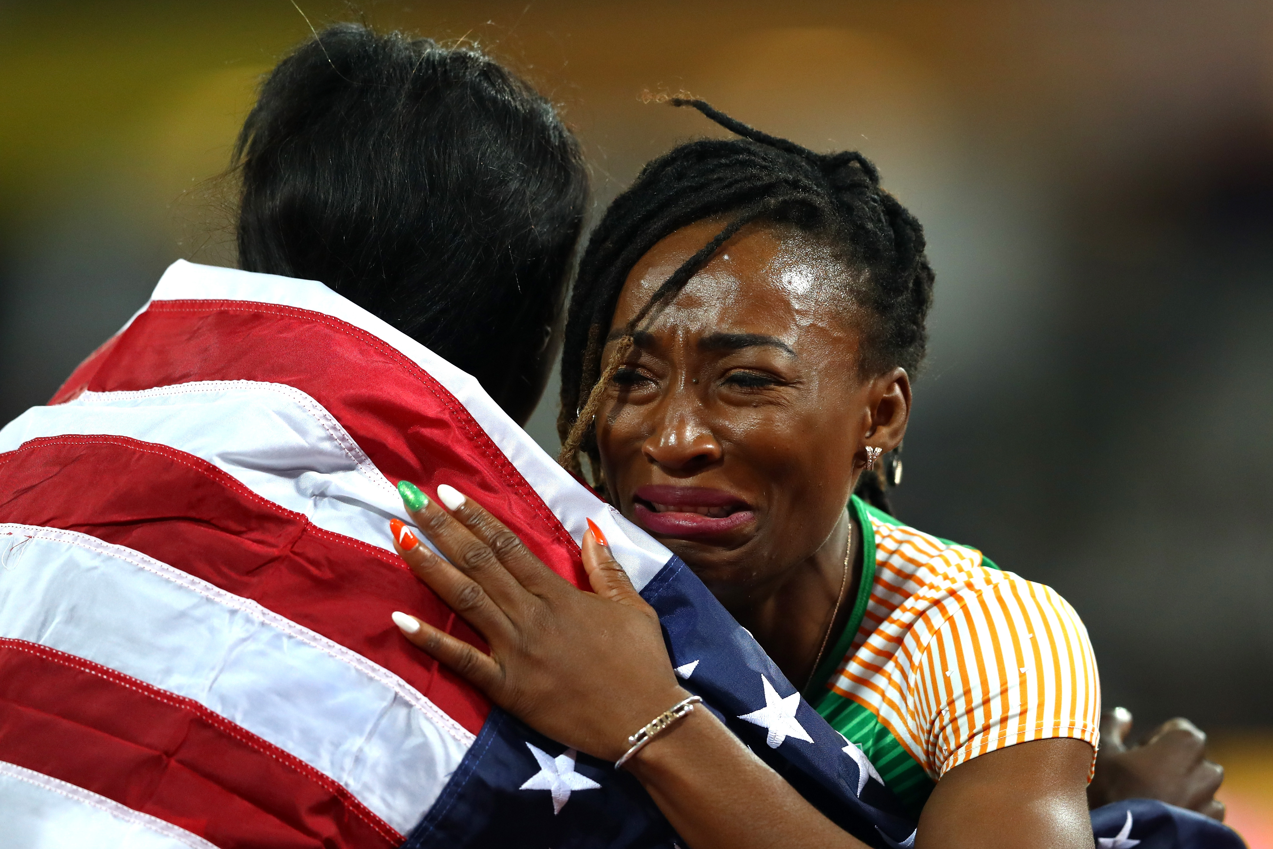 Tori Bowie of the United States, gold, celebrates with Marie-Josee Ta Lou of the Ivory Coast, silver, after the Women's 100 Metres Final during day three of the 16th IAAF World Athletics Championships at The London Stadium on August 6, 2017 in London, United Kingdom. | Source: Getty Images