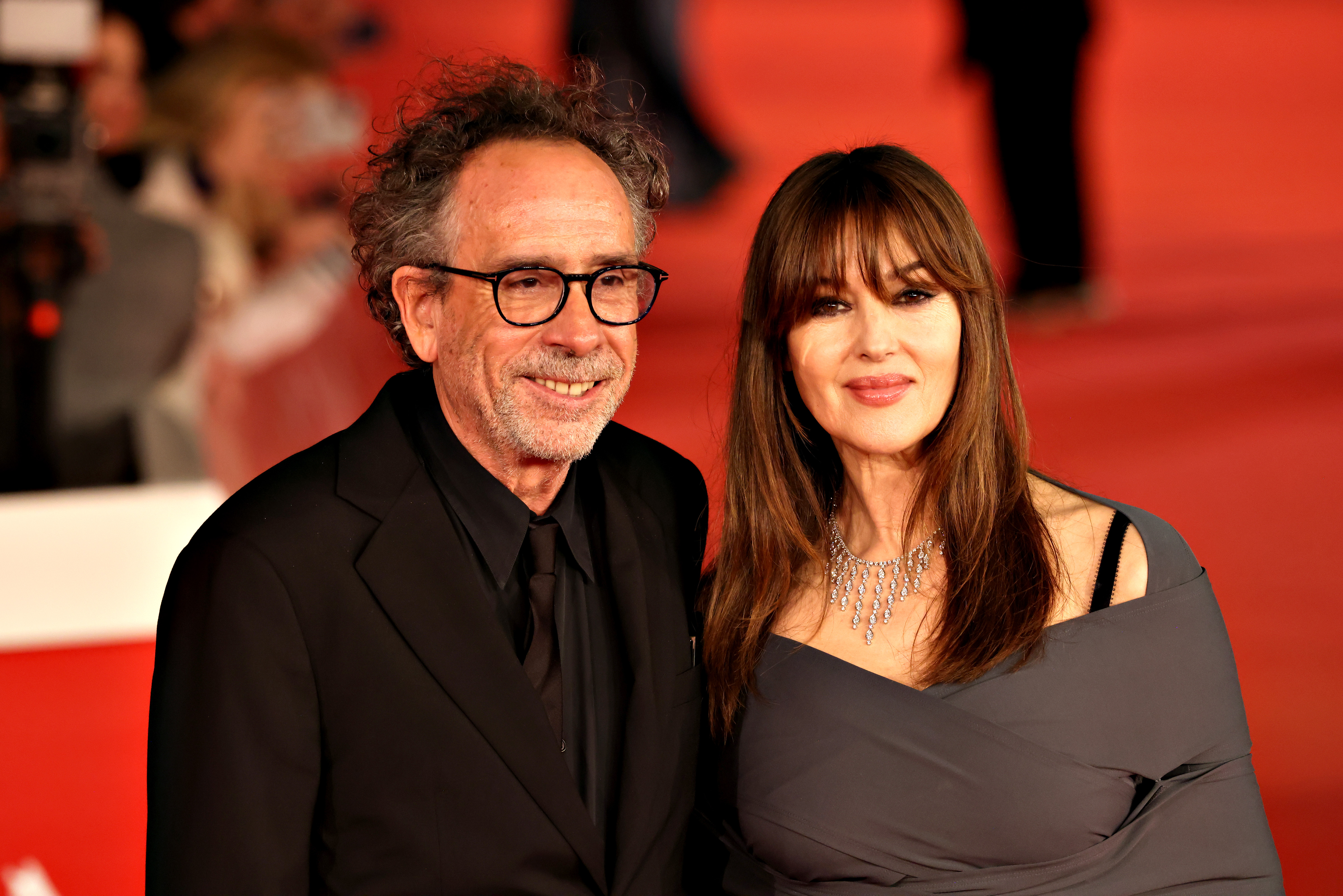 Tim Burton and Monica Bellucci at a red carpet for the movie "Diabolik Chi Sei?" in Rome, Italy on October 19, 2023 | Source: Getty Images