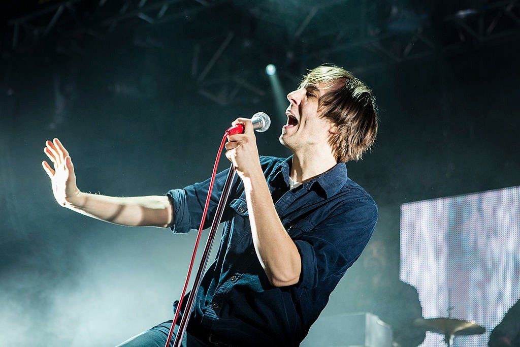 Thomas Mars of Phoenix performs on stage at Manchester Academy on February 11, 2014 | Photo: Getty Images