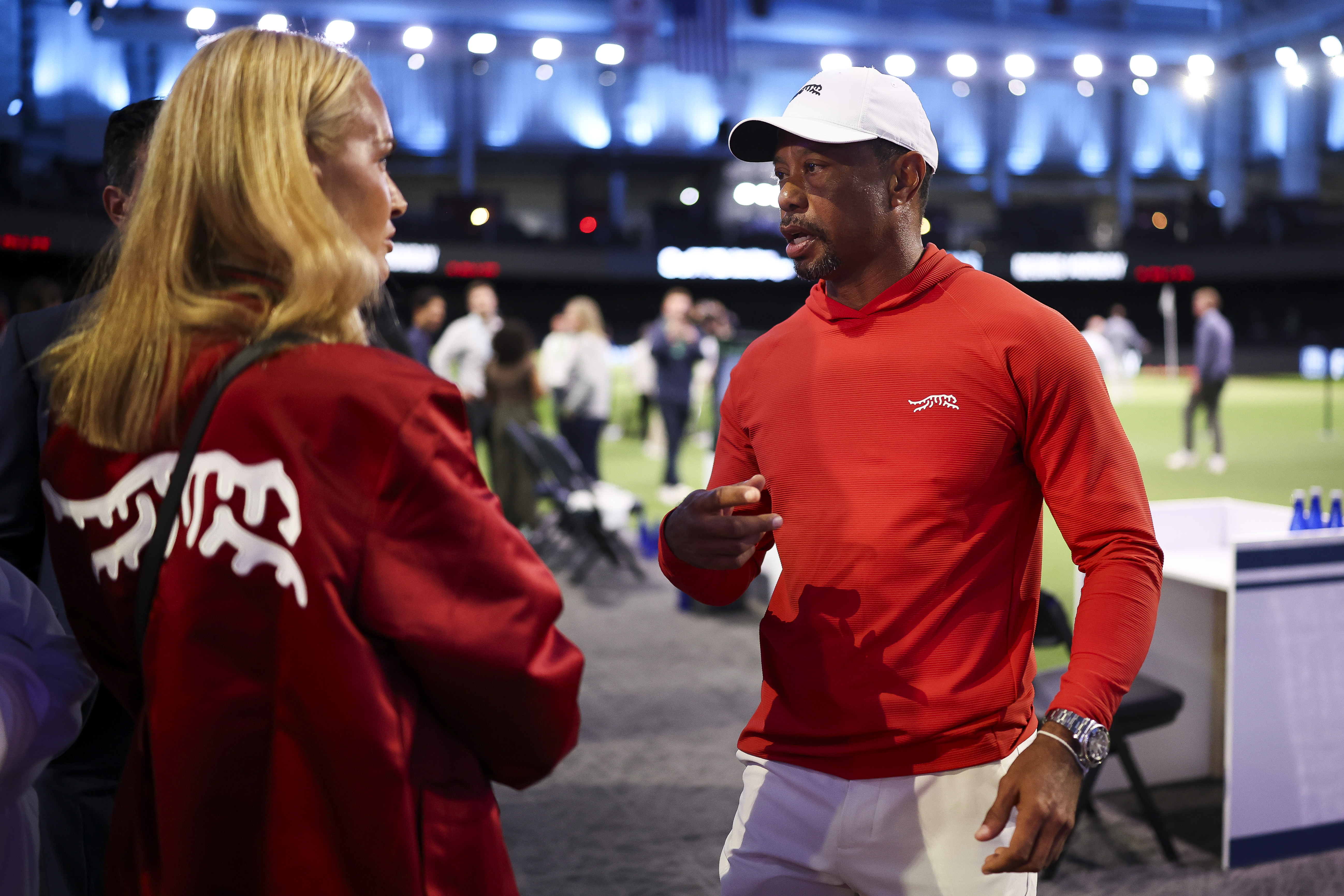 Tiger Woods talks with Vanessa Trump after a match against Boston Common Golf on March 17, 2026 | Source: Getty Images