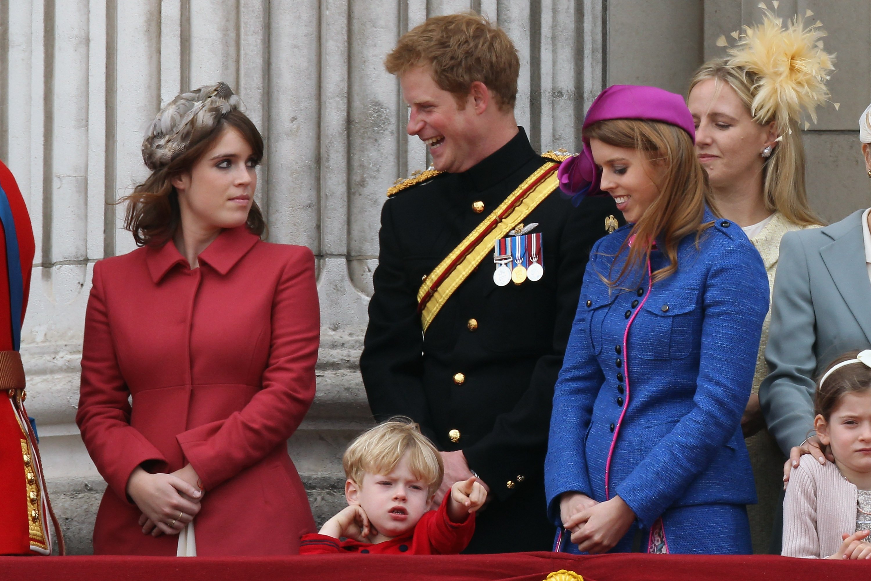 Princess Eugenie, Prince Harry, and Princess Beatrice on the balcony of Buckingham Palace after the Trooping the Colour ceremony on June 16, 2012, in London, England. | Source: Dan Kitwood/Getty Images