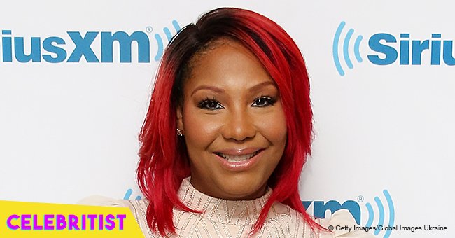 Traci Braxton, 46, shows off slimmer curves in figure-hugging top & distressed jeans in recent pic