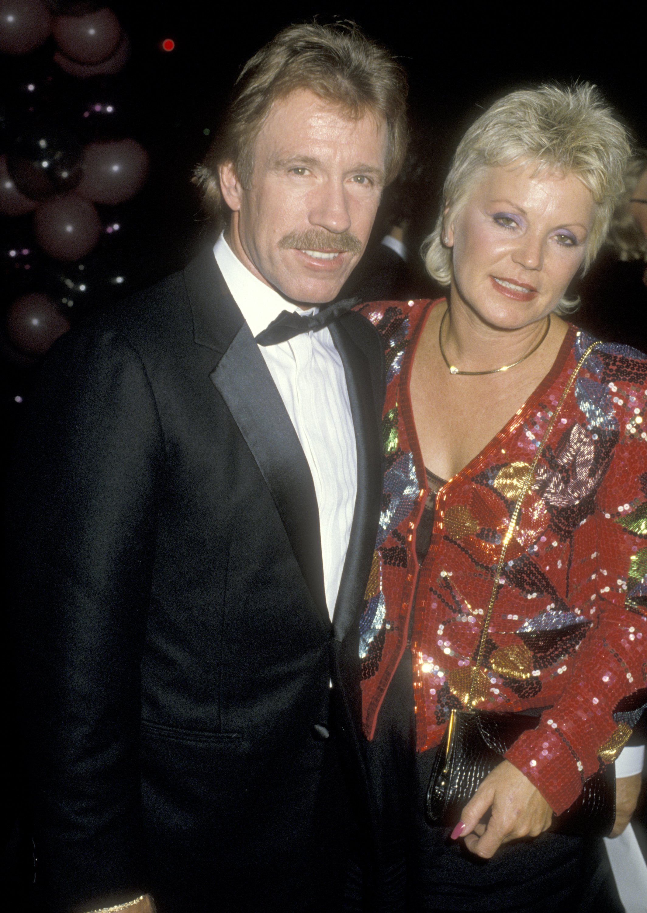  Chuck Norris and Diane Holechek are pictured at "The Naked Cage" Hollywood Premiere on February 22, 1986, at Cannon Films Headquarters in Hollywood, California | Source: Getty Images
