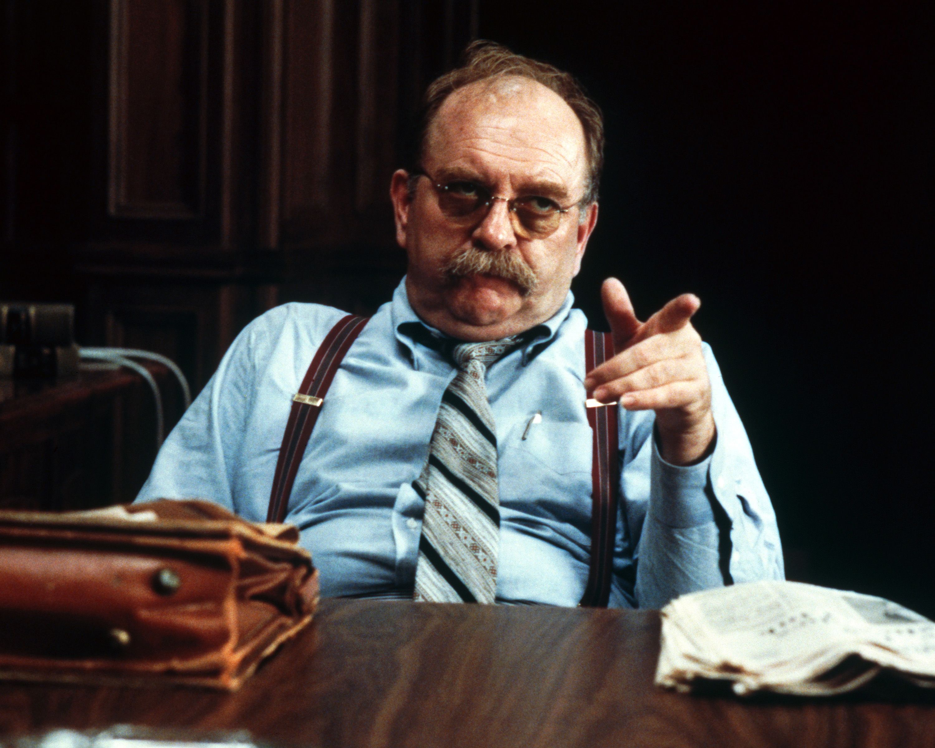 Actor Wilford Brimley sitting behind a desk during a scene from Sydney Pollack's "Absence of Malice" in 1981 | Photo: Silver Screen Collection/Getty Images