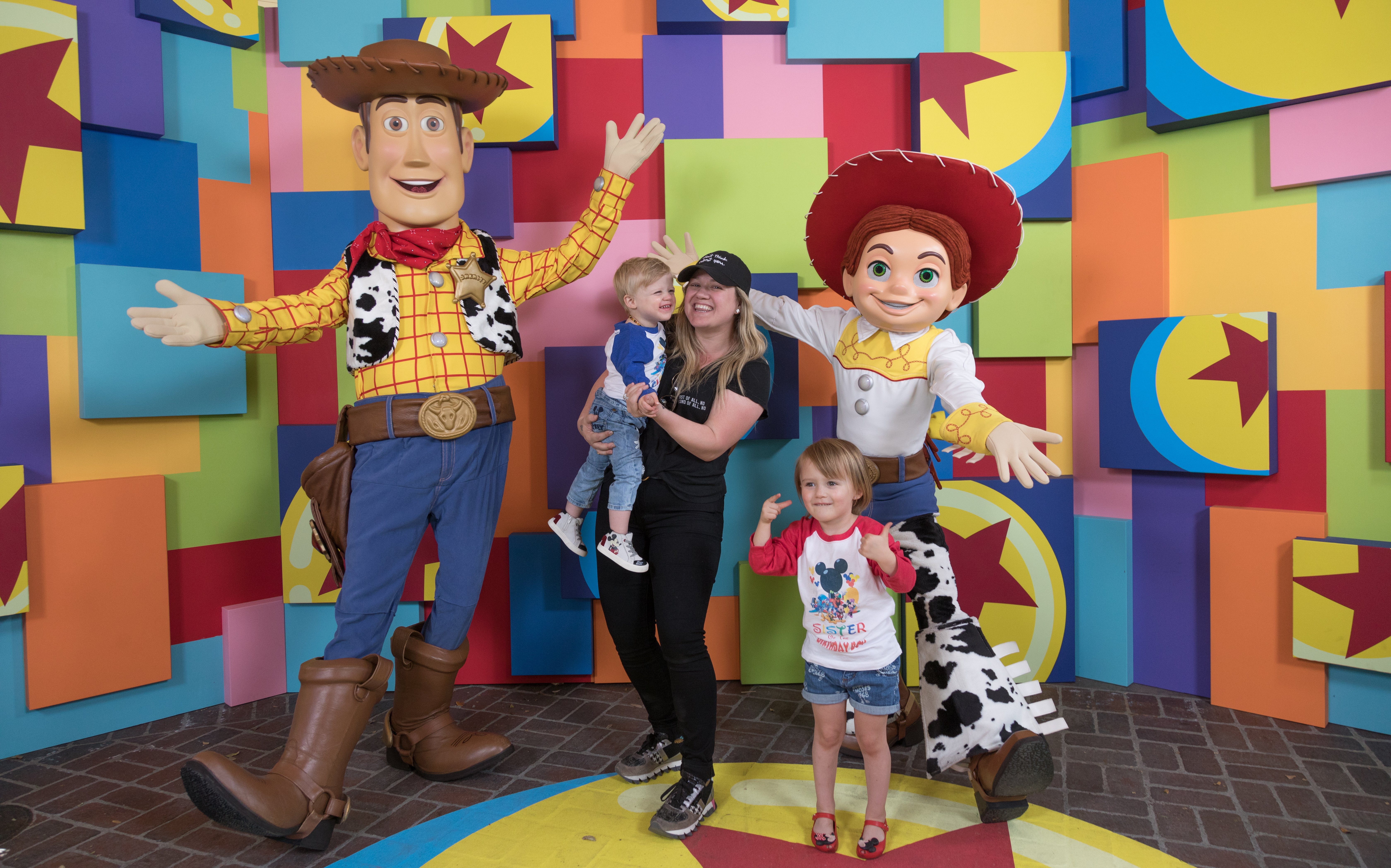 Kelly Clarkson and her children, Remington and River visiting with Woody and Jessie at the launch of Pixar Fest at the Disneyland Resort in Anaheim, California. | Source: Getty Images