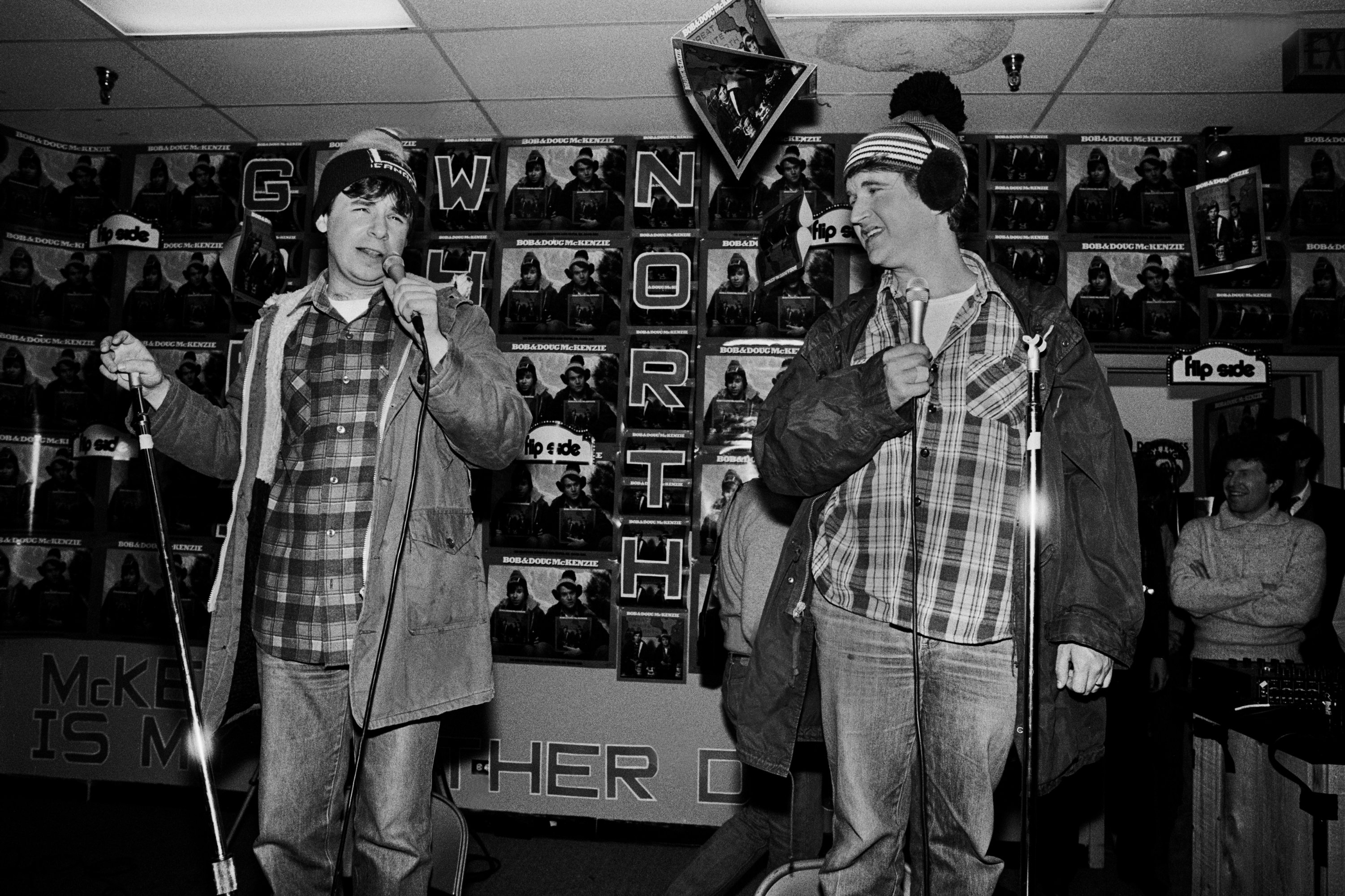 Rick Moranis as Bob McKenzie and his brother Doug, played by Dave Thomas, appearing at Flip Side Records on January 14, 1982 in Chicago, Illinois | Source: Getty Images