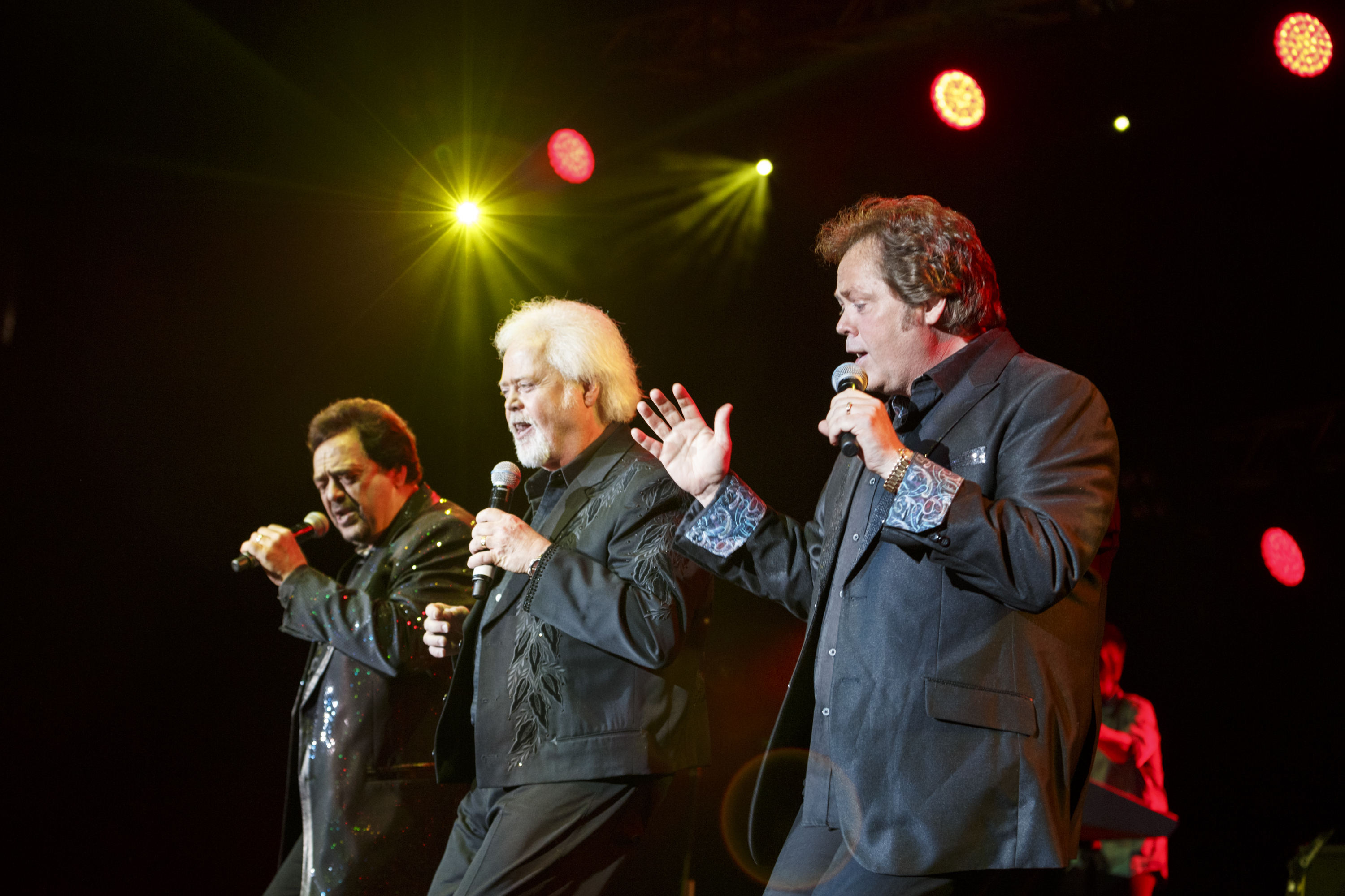 Jay Osmond, Merrill Osmond, and Jimmy Osmond performing at Phones 4 U Arena in Manchester, United Kingdom, on June 20, 2014. | Source: Getty Images