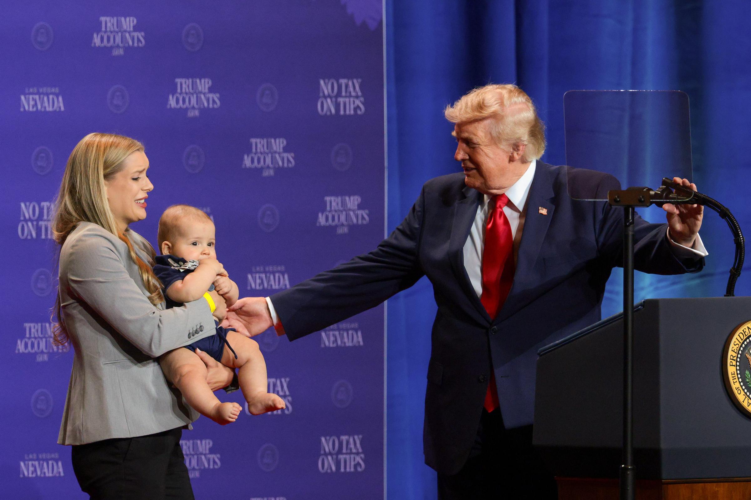 Donald Trump greeted a family who benefited from the "no tax on tips" policy during an event at Red Rock Casino Resort and Spa on August 5, 2026, in Las Vegas, Nevada. | Source: Getty Images