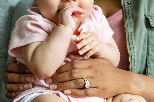 woman holding baby | Source: Unsplash