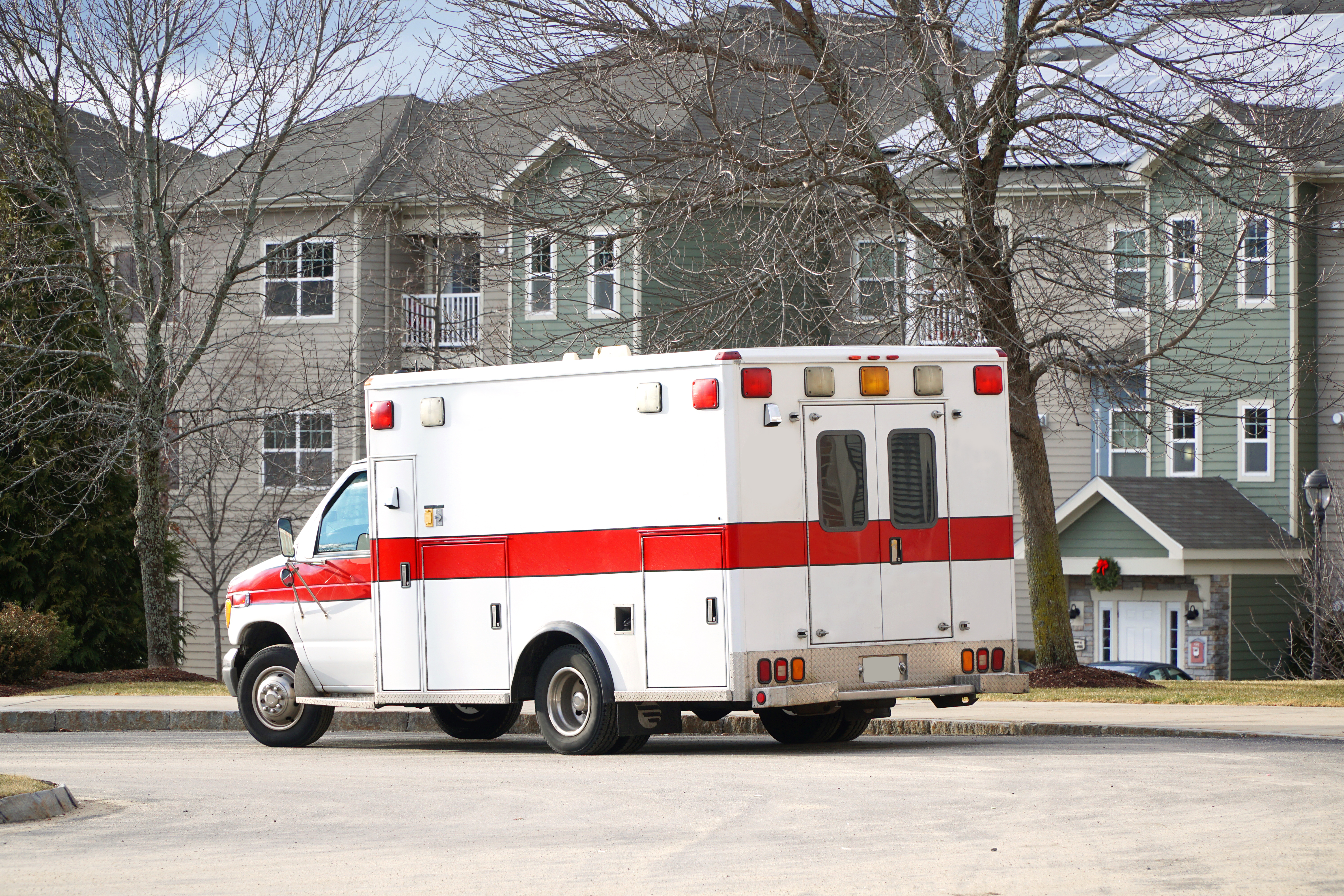 An ambulance parked near a house | Source: Shutterstock