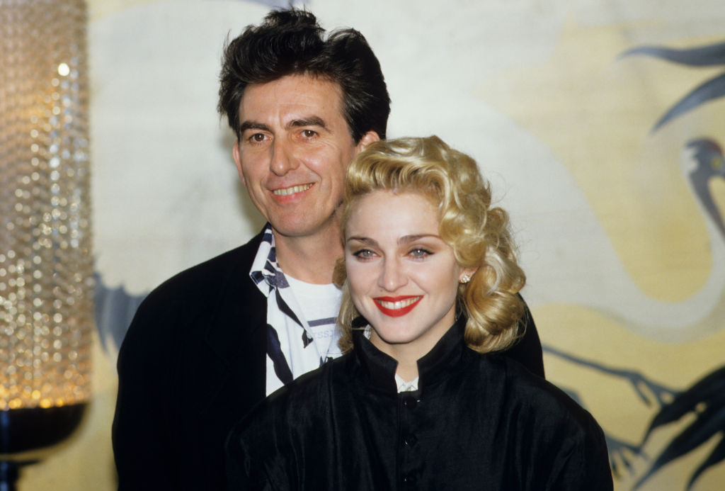 Madonna and former Beatle George Harrison Beatles at the Kensington Roof Gardens, London, 1986 | Source: Georges De Keerle/Getty Images