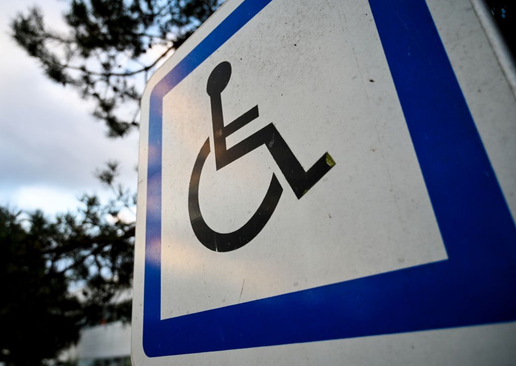 A sign indicating a parking space for vehicles of persons with reduced mobility | Photo: Getty Images