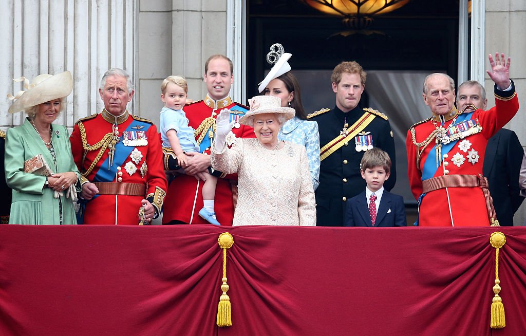 Duchess of Cornwall, Prince Charles, Prince George, Prince William, Kate Middleton, Queen Elizabeth II, Prince Harry and Prince Philip watch the fly-past from the balcony of Buckingham Palace on June 13, 2015 in London, England | Photo: Getty Images