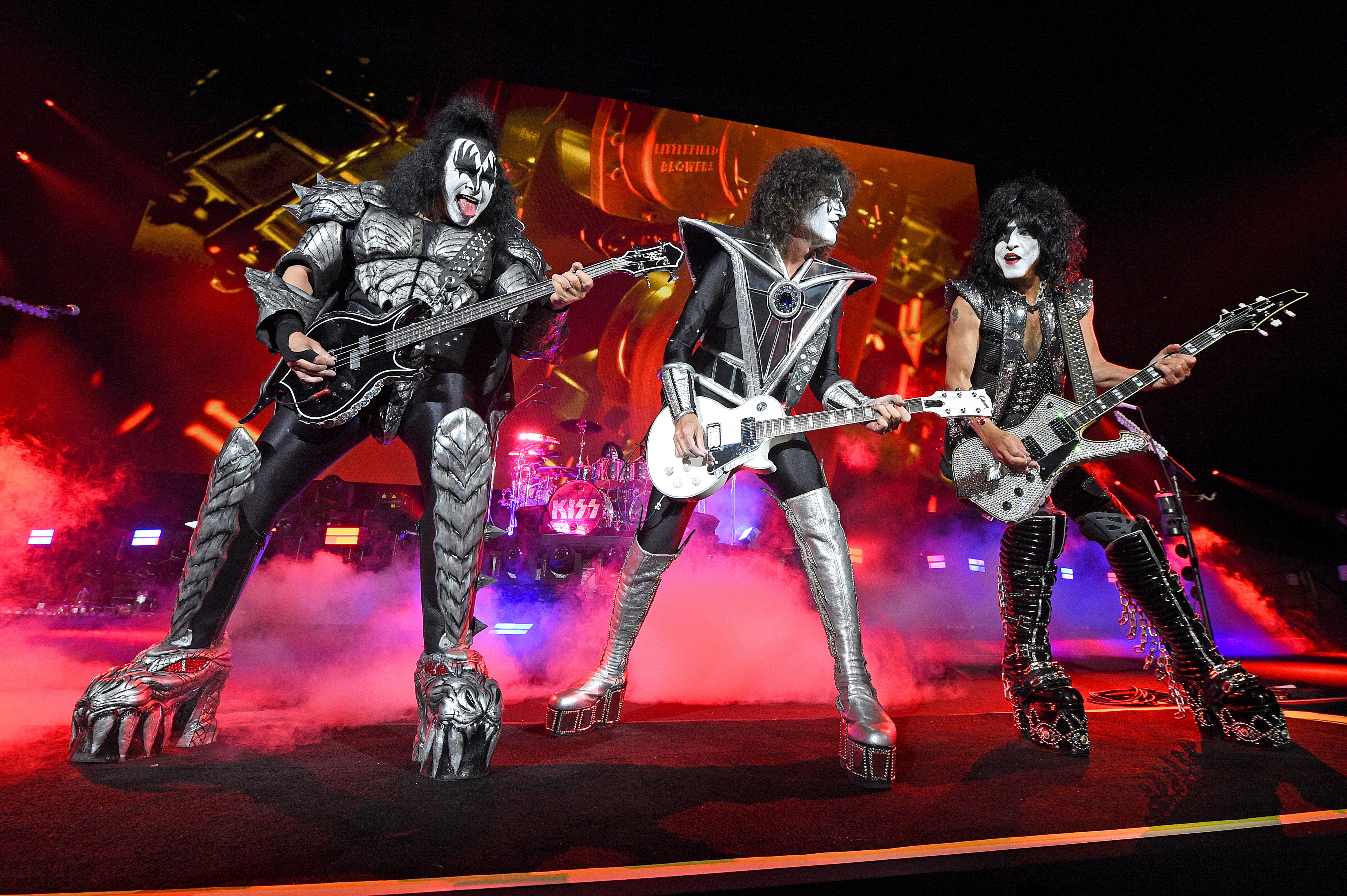 Gene Simmons, Tommy Thayer, and Paul Stanley from KISS performing on stage during the Tribeca Festival screening of "Biography: KISStory" at Battery Park in New York City | Photo: Kevin Mazur/Getty Images for A&E