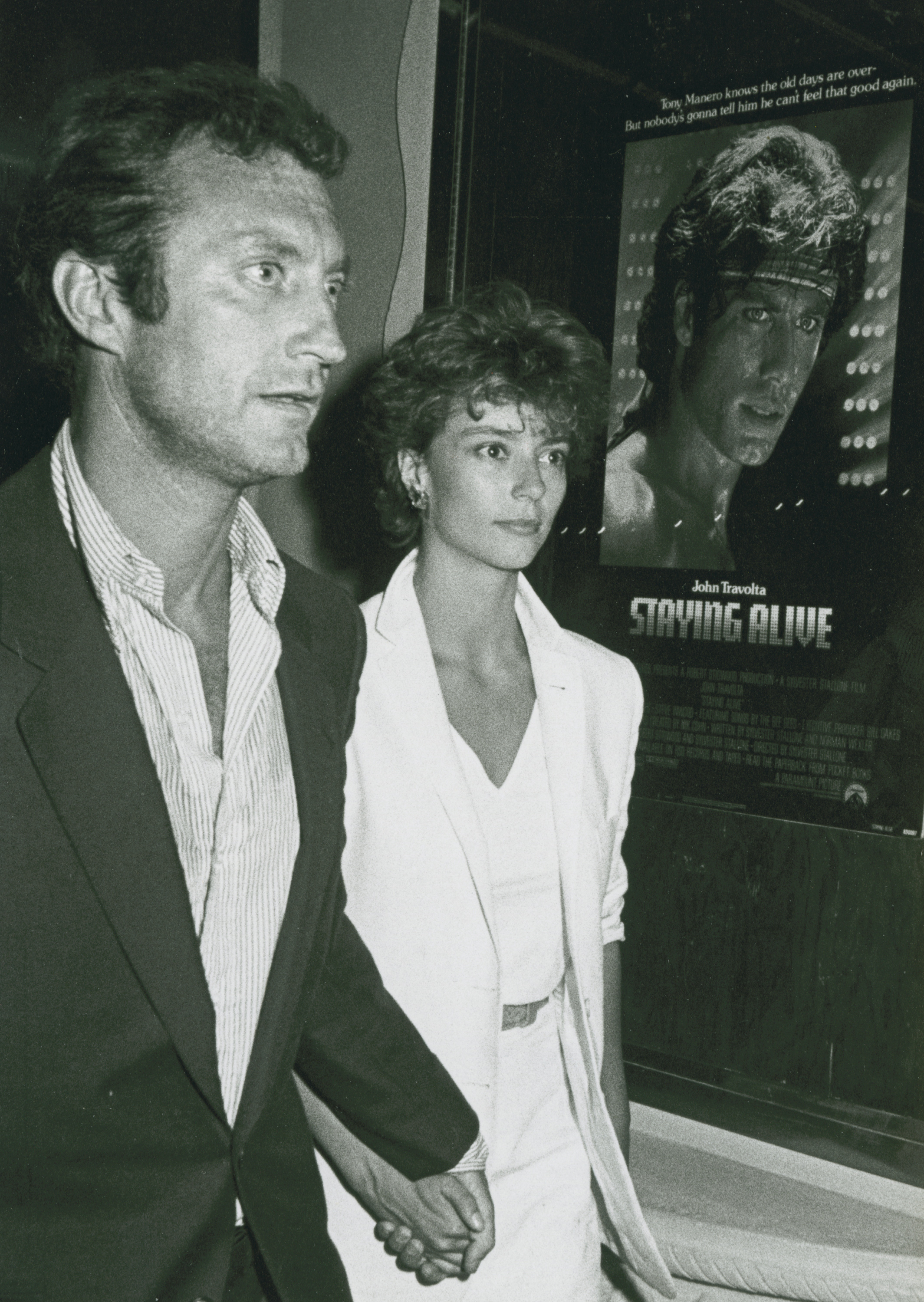 The actress and her husband Bryan Brown at the "Staying Alive" premiere in 1983 | Source: Getty Images