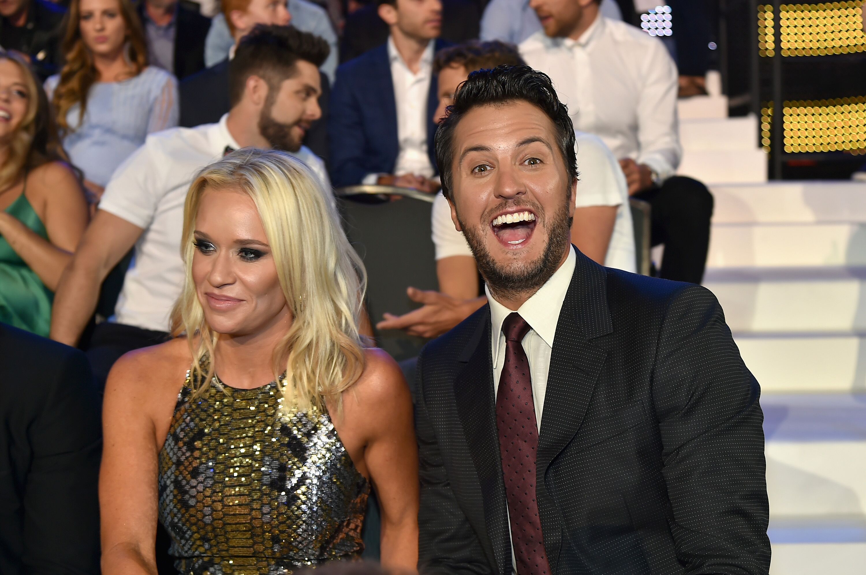 Luke Bryan (R) and Caroline Boyer (L) watch the 2017 CMT Music awards at the Music City Center | Getty Images