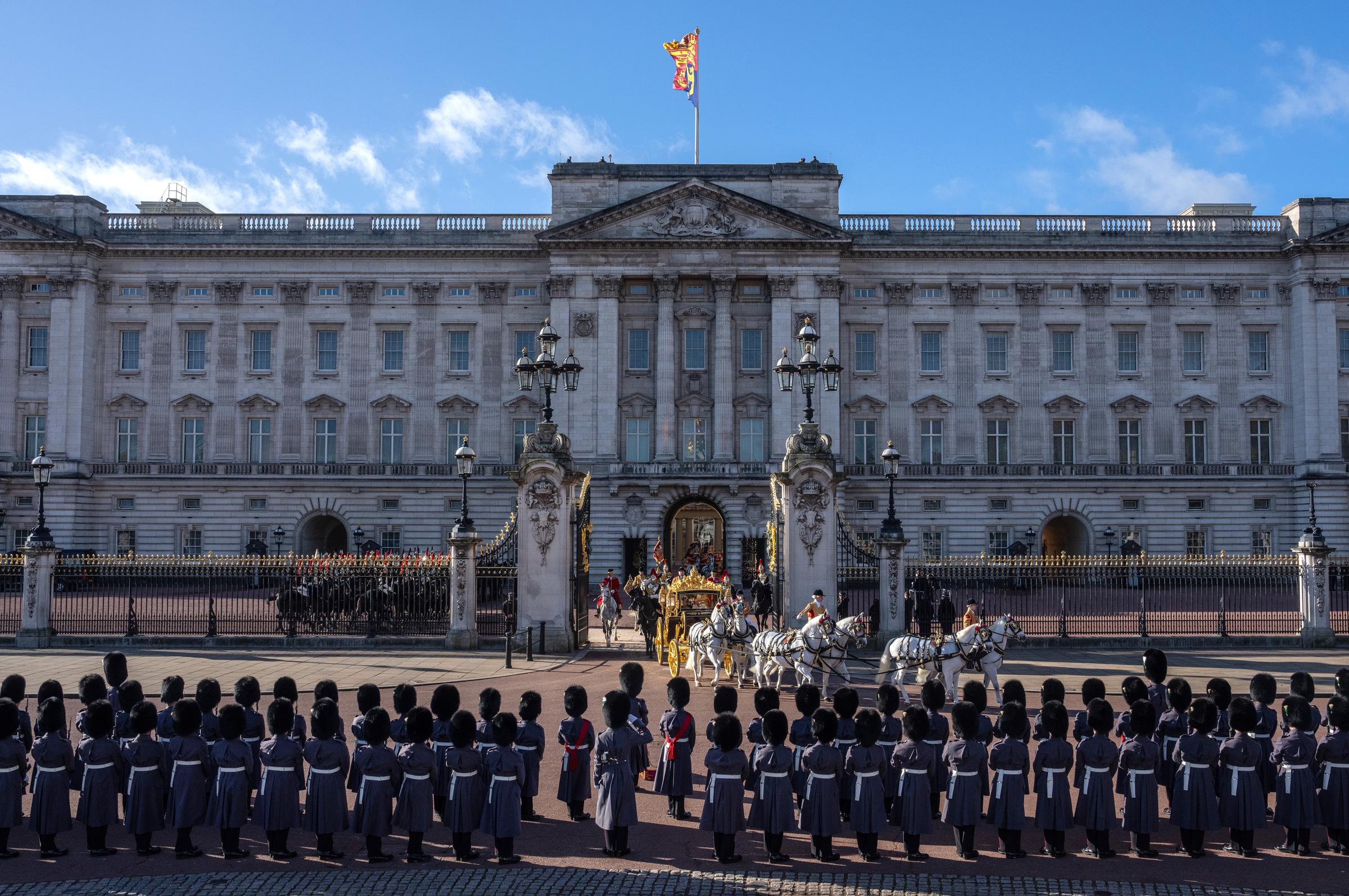 Members of the King's Guard line up outside Buckingham Palace as King Charles III and Queen Camilla depart in the Diamond Jubilee State Coach for the Houses of Parliament ahead of the State Opening of Parliament on November 7, 2023, in London, England. | Source: Getty Images