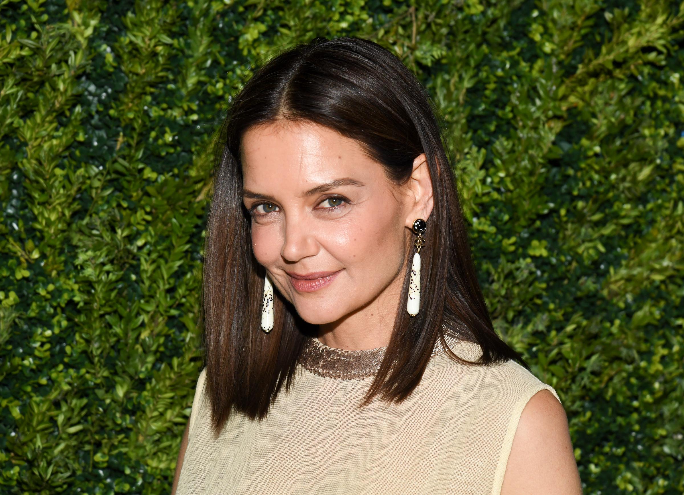 A few days before the East Hampton outing, Holmes attended the CHANEL Tribeca Festival Artists Dinner on her own. Soon afterward, eyewitnesses told People they saw her spending the evening with Yarmosky at a movie screening. | Source: Getty Images