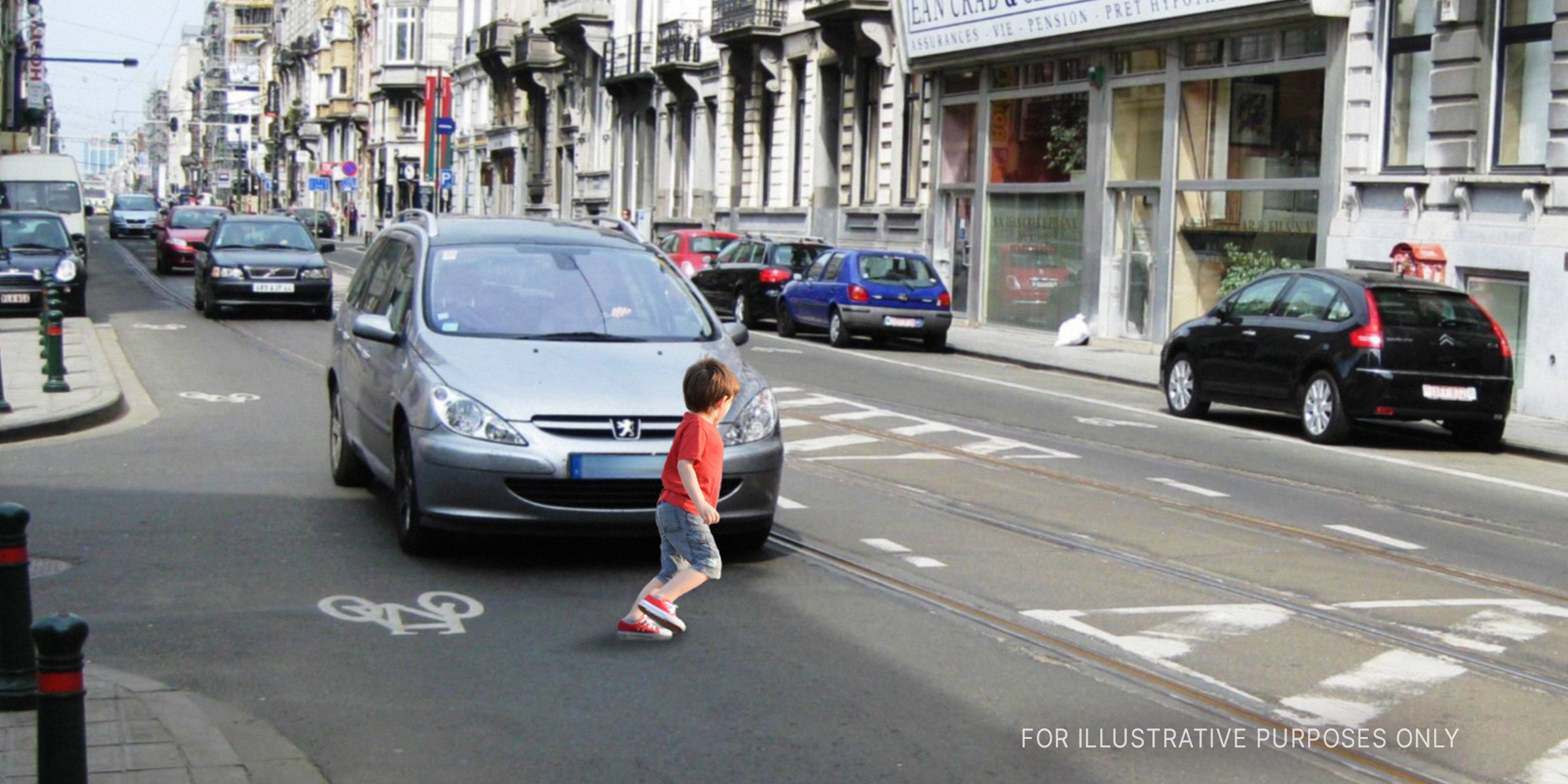 Young boy in front of car on the road | Source: Shutterstock, Flickr / andynash (CC BY-SA 2.0) 