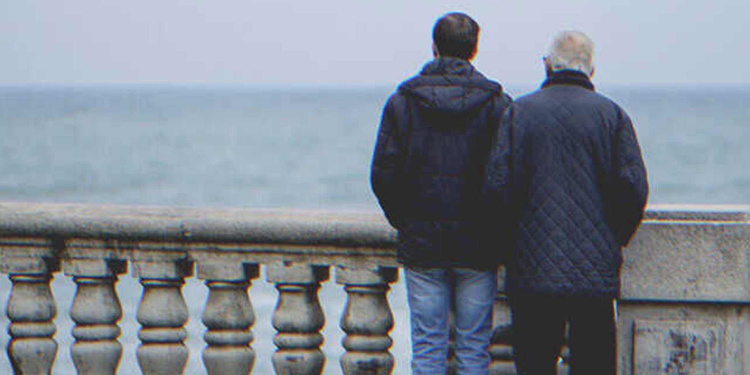A man and an older man looking at the ocean | Source: Shutterstock