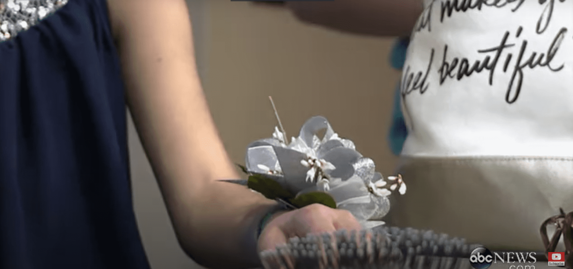 Rebekah's shimmery corsage for her special date with her brother for his winter formal. | Source: Youtube.com/ABC News