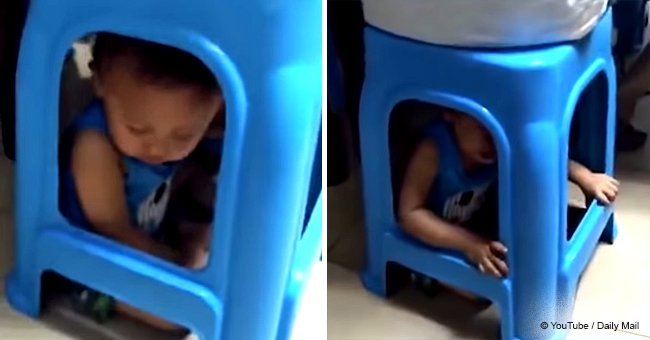 Mother caused public outrage for trapping toddler son under a plastic stool (video)