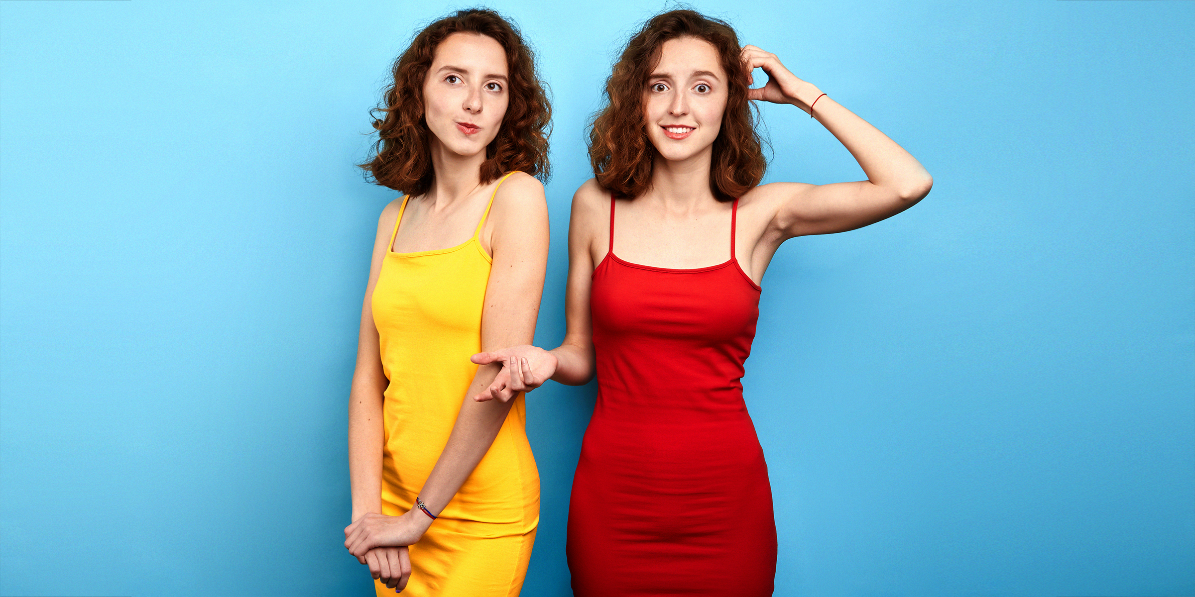 Two women wearing dresses cinched at the waist | Source: Shutterstock