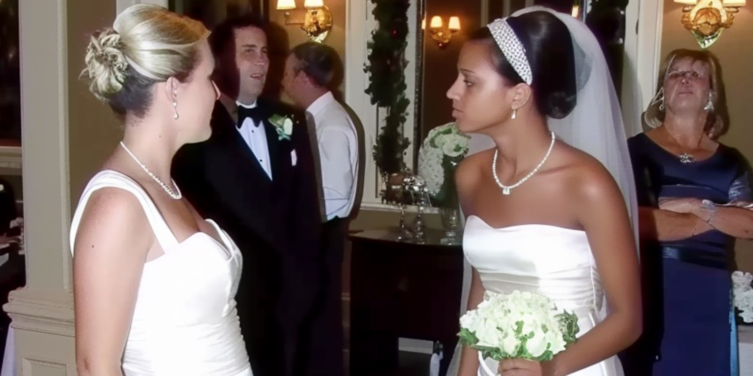 Stunned bride looking at another woman in wedding dress | Source: Amomama
