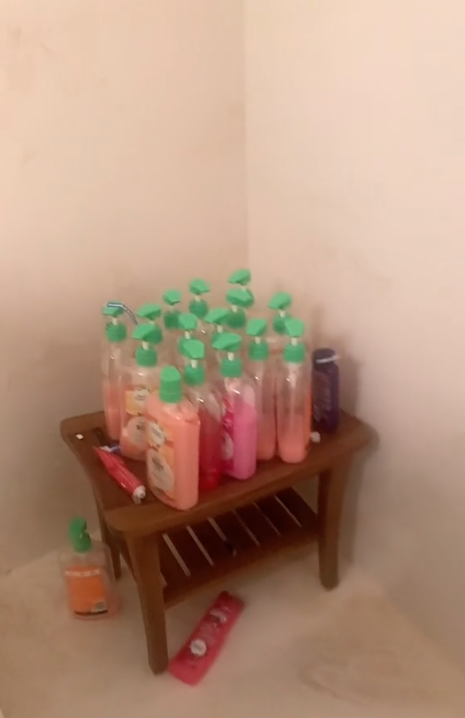 The woman discovered over a dozen bottles of soap in the shower. | Source: TikTok.com/@missmcnallyyy