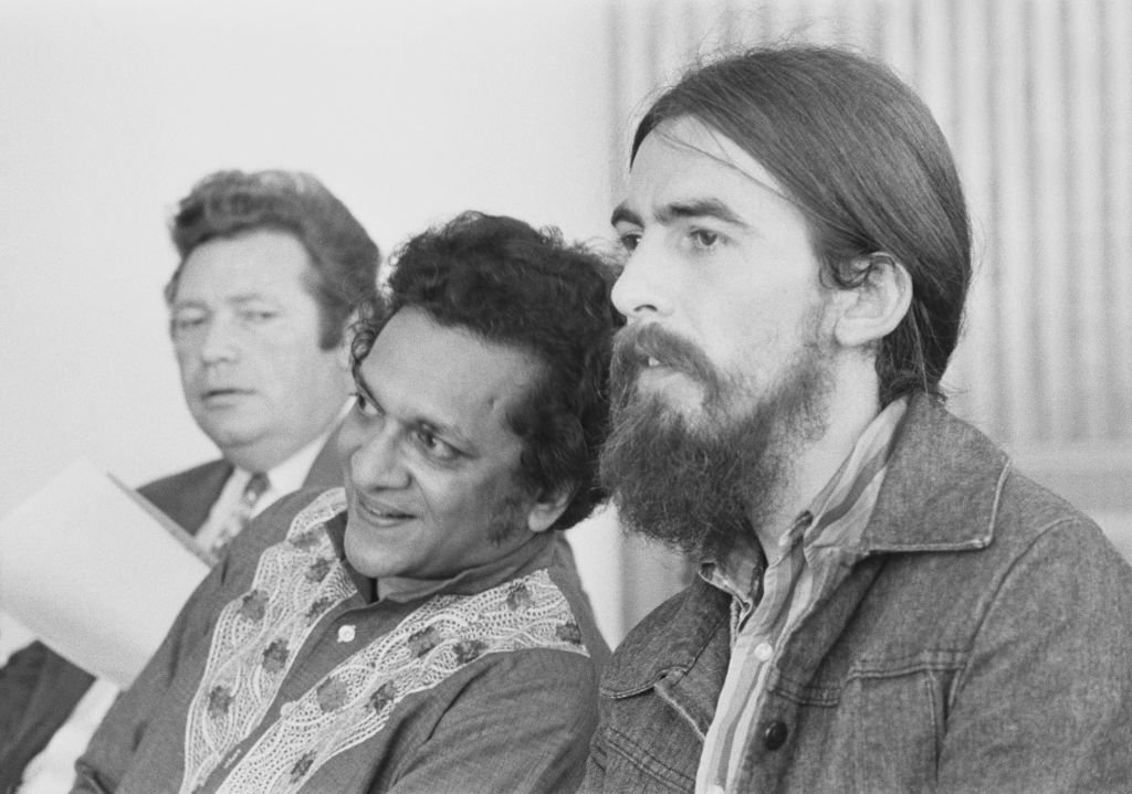 English musician George Harrison (1943-2001) of The Beatles posed on right with Indian musician Ravi Shankar (1920-2012) at a press reception at the Royal Festival Hall in London | Getty Images / Global Images Ukraine English musician George Harrison (1943-2001) of The Beatles posed on right with Indian musician Ravi Shankar (1920-2012) at a press reception at the Royal Festival Hall in London | Getty Images / Global Images Ukraine