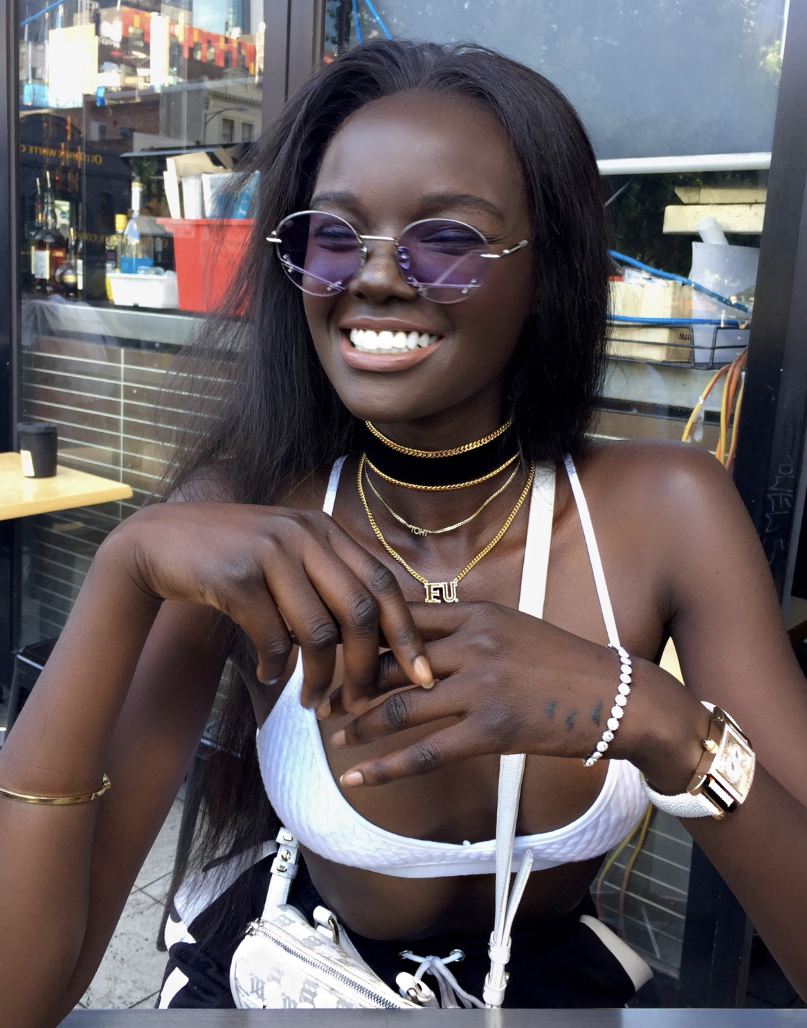 Nyadak "Duckie" Thot smiling in a photo uploaded on December 26, 2017, in Melbourne, Victoria | Source: X/duckiethot