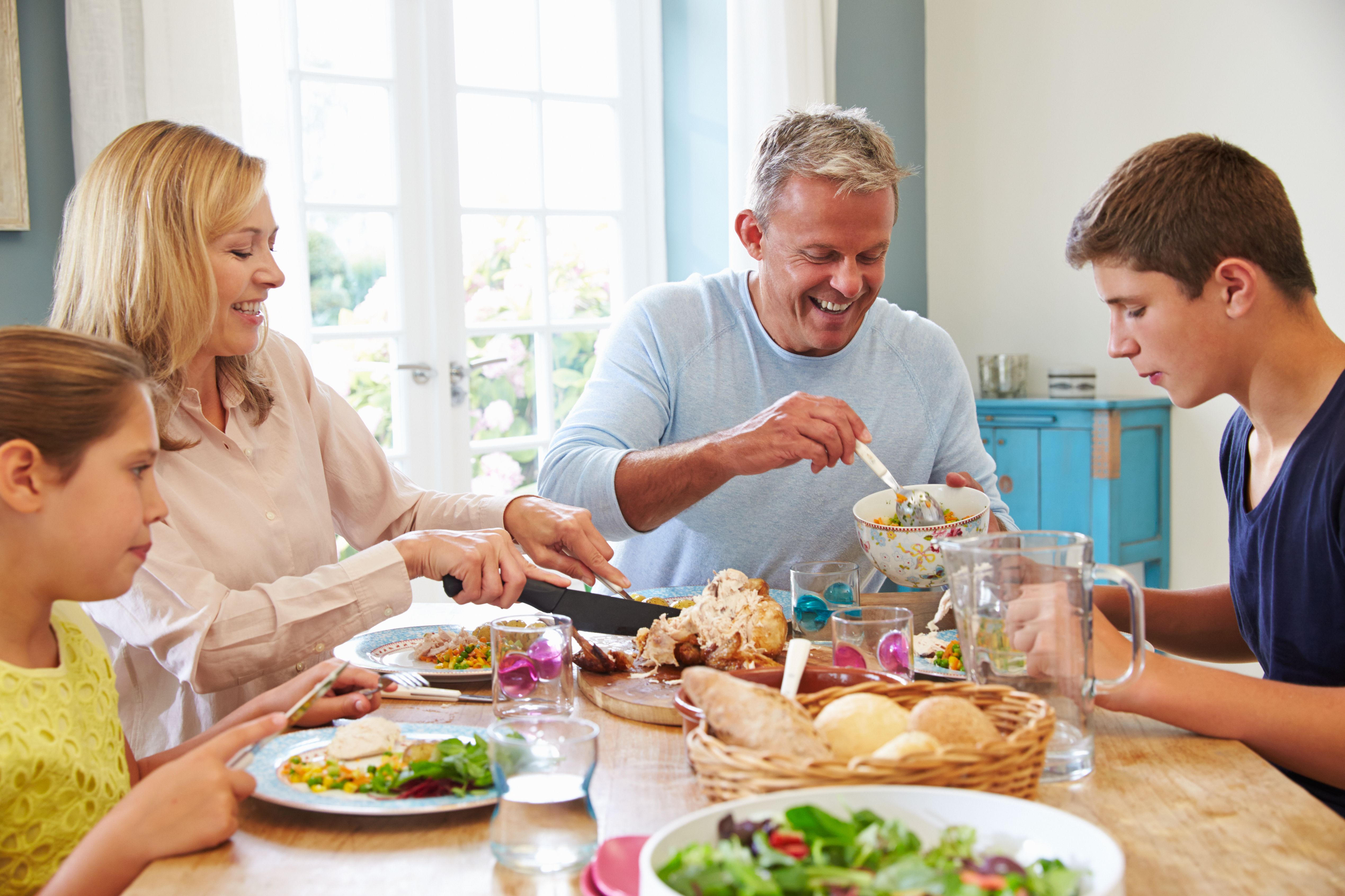 A family having dinner. | Source: Shutterstock