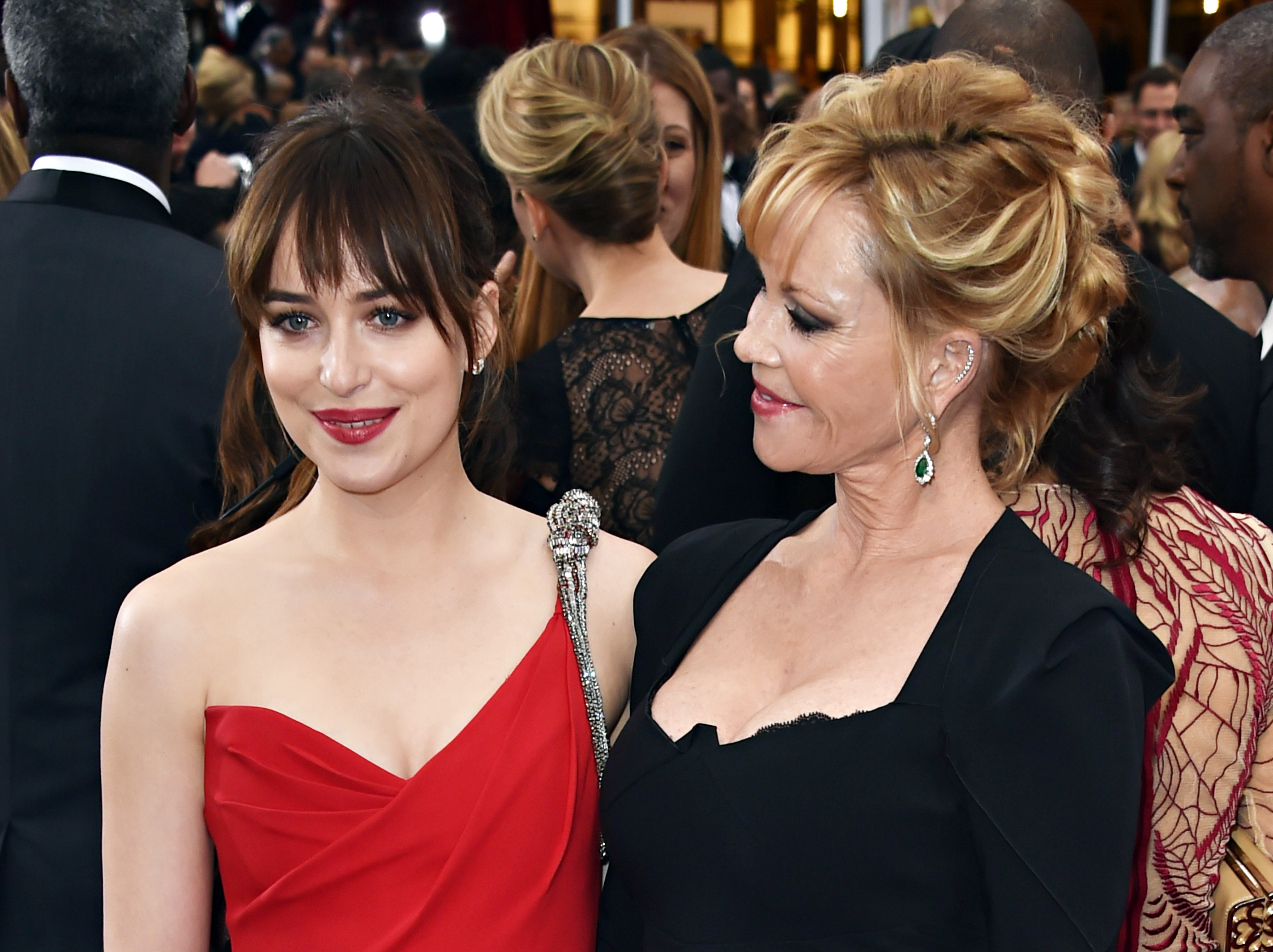 Dakota Johnson and Melanie Griffith arrive on the red carpet for the 87th Oscars in Hollywood, California on February 22, 2015 | Source: Getty Images