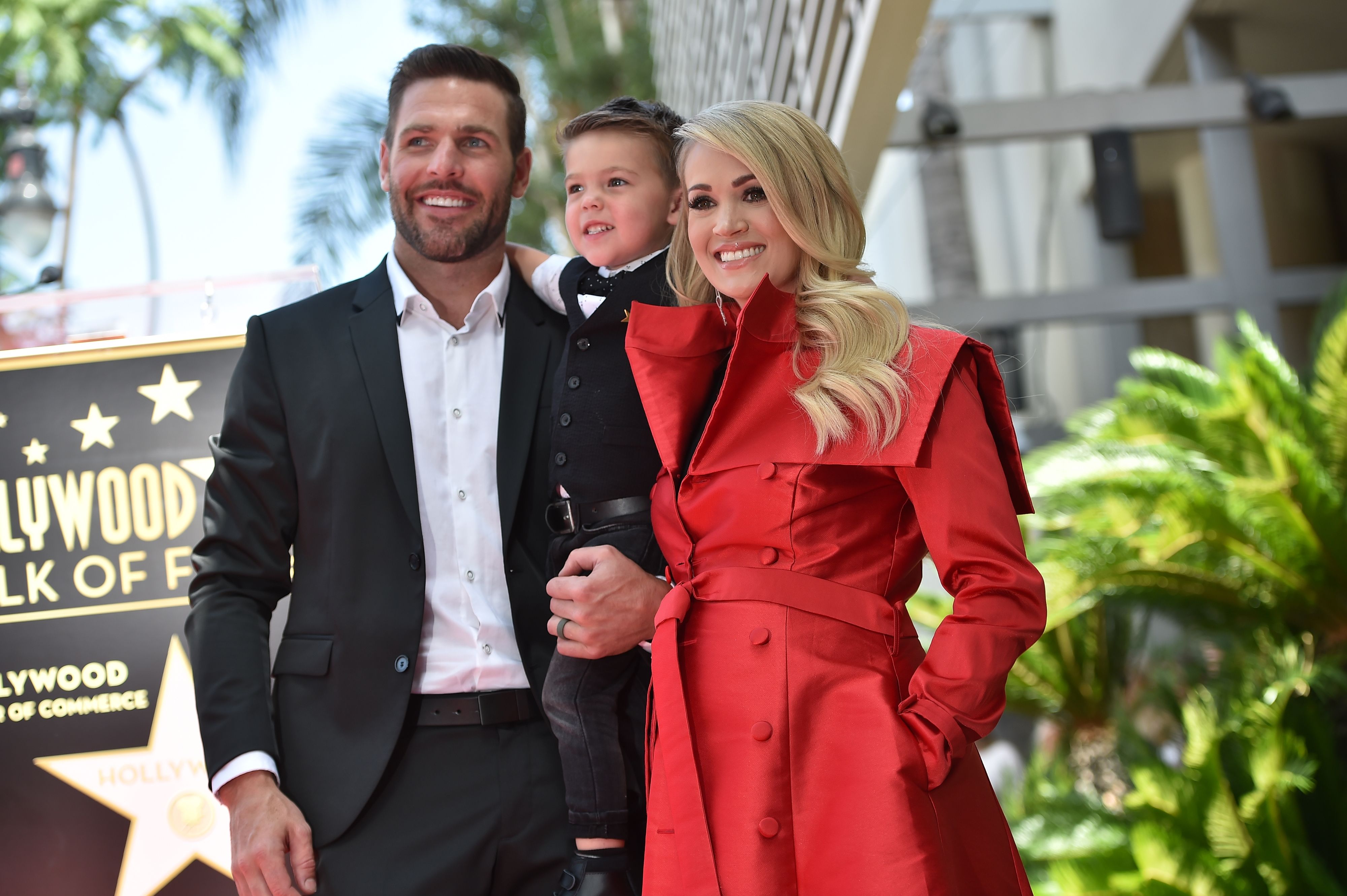 Carrie Underwood with her husband Mike Fisher and their son Isaiah in Hollywood in 2018 | Source: Getty Images