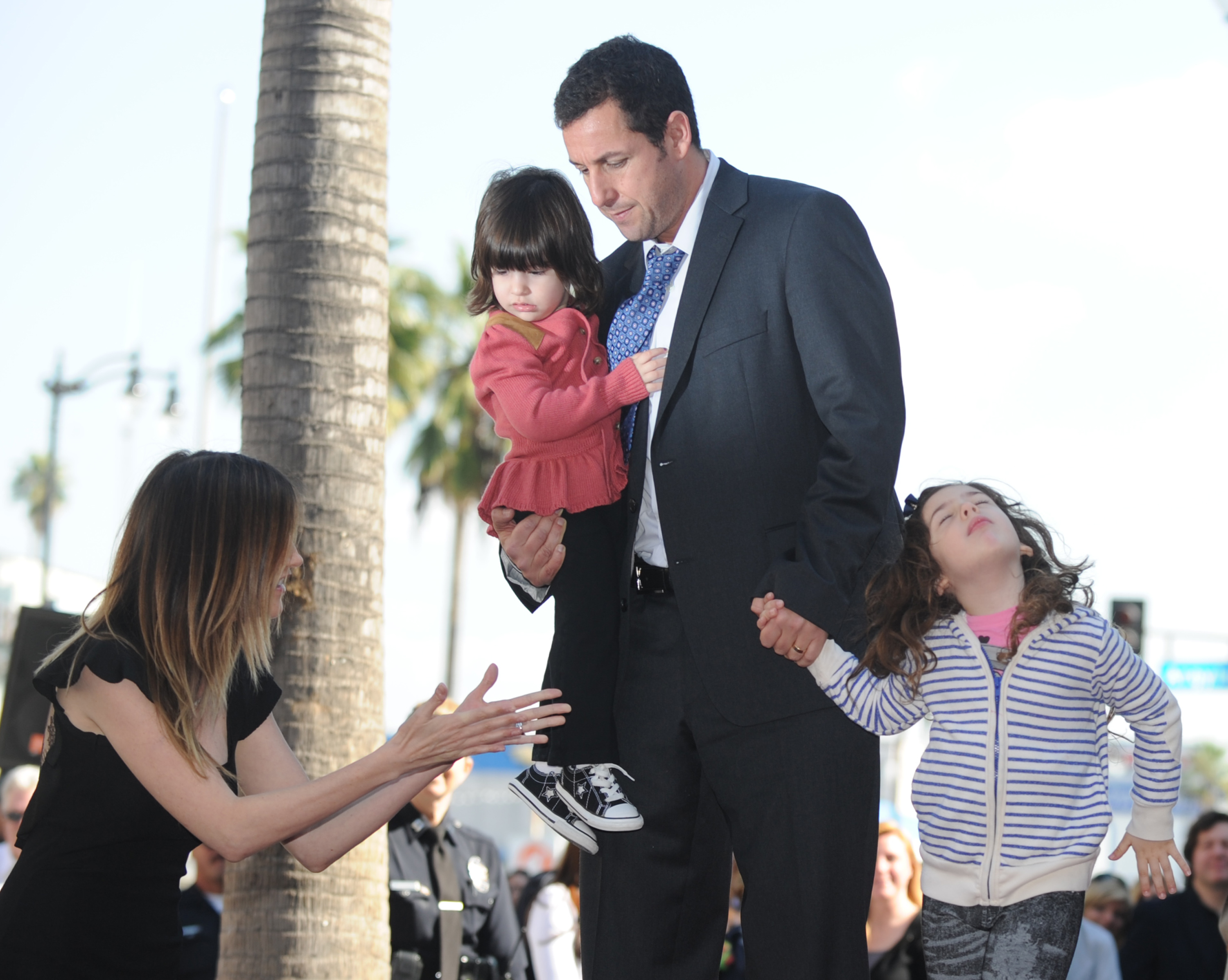 Adam Sandler, Jackie Sandler and their daughters Sunny Madeline (L) and Sadie Madison as he is honored with a star on the Hollywood Walk of Fame in Hollywood, California, on February 1, 2011. | Source: Getty Images