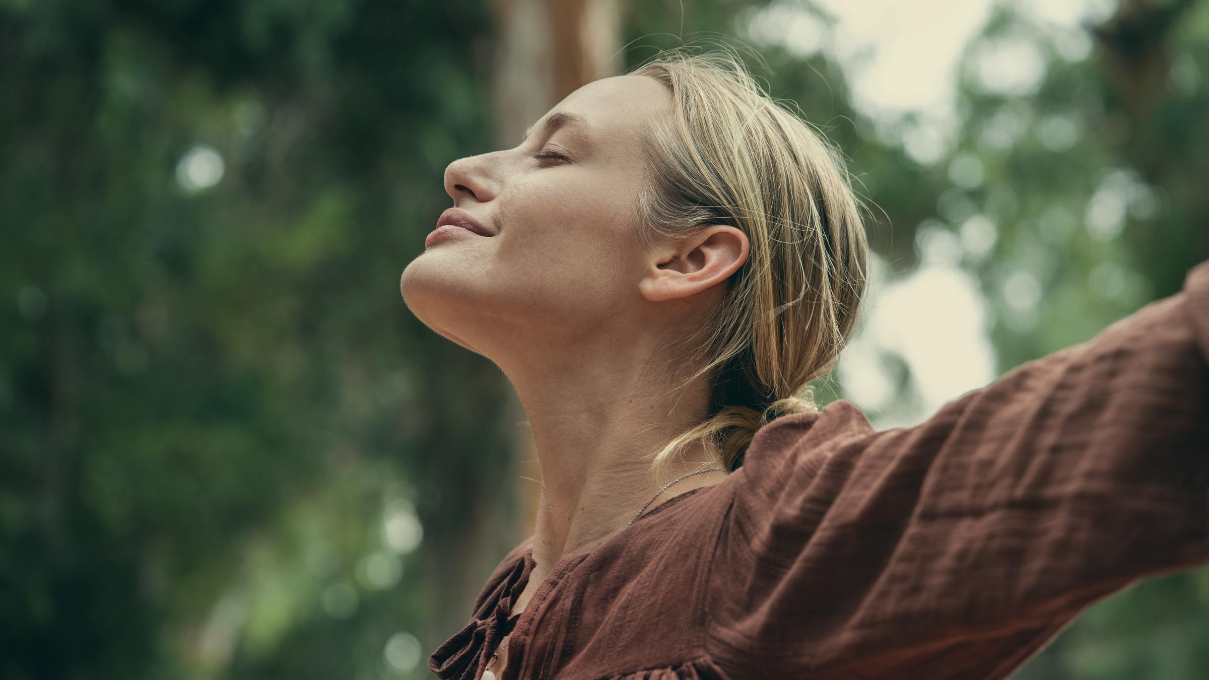 A woman taking a breath in | Source: Getty Images