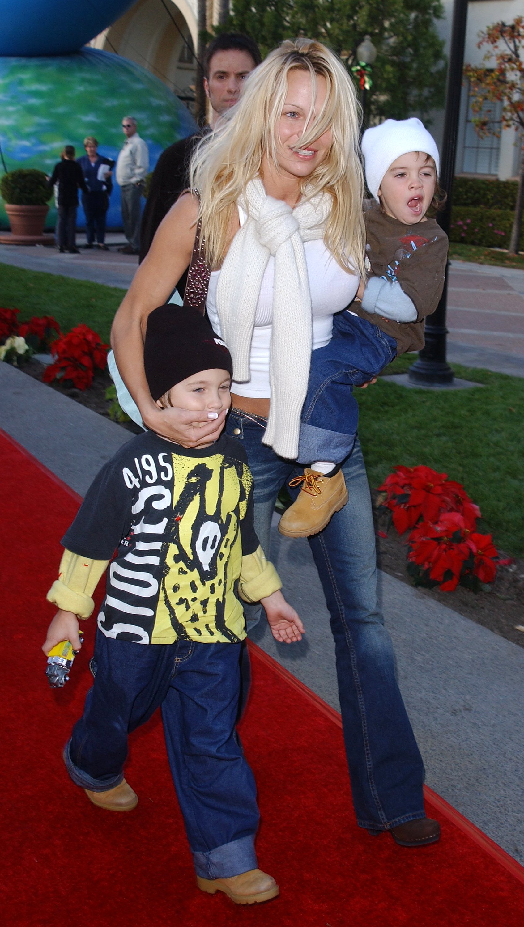 Pamela Anderson and sons Dylan (L) and Brandon (R) attend the premiere of "Jimmy Neutron: Boy Genius" on December 9, 2001, at Paramount Studios, in Hollywood. | Source: Getty Images