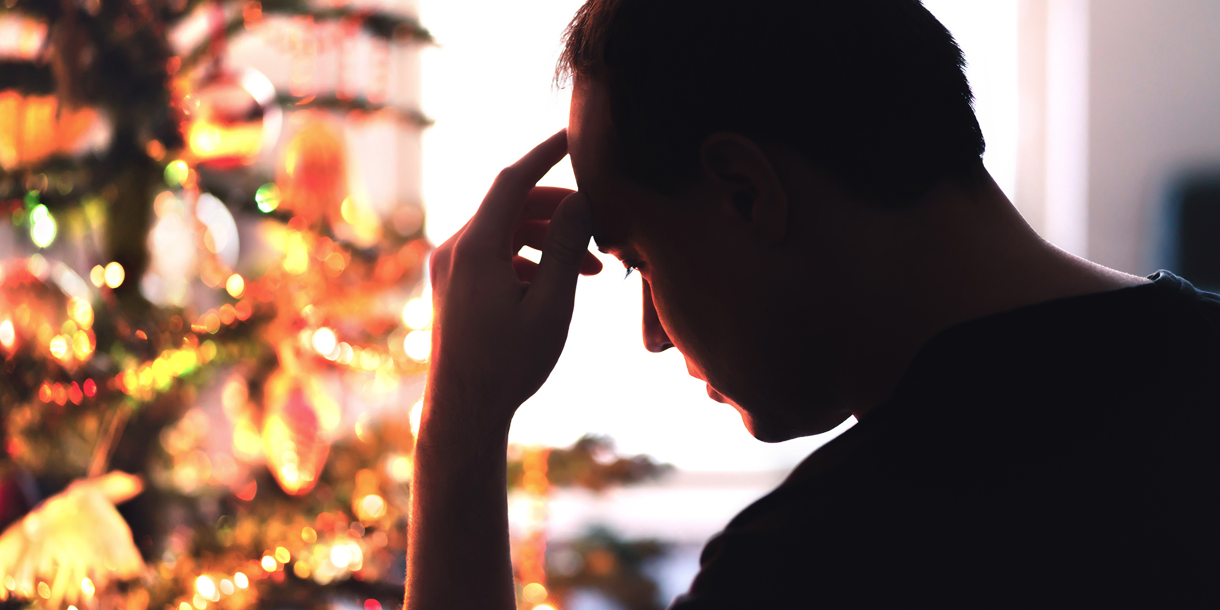 Man staring at a Christmas tree | Source: Getty Images