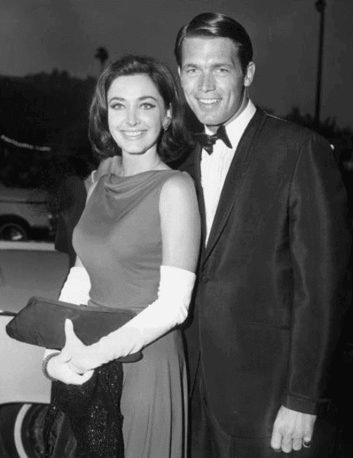  Shelby Grant and Chad Everett pose in formal attire at the west coast premiere of director Vincente Minnelli's film, 'The Sandpiper,' Hollywood Paramount Theatre, Hollywood, California. The screening was a benefit for the Hemophilia Foundation of Southern California. (Photo by Hulton Archive/Getty Images)