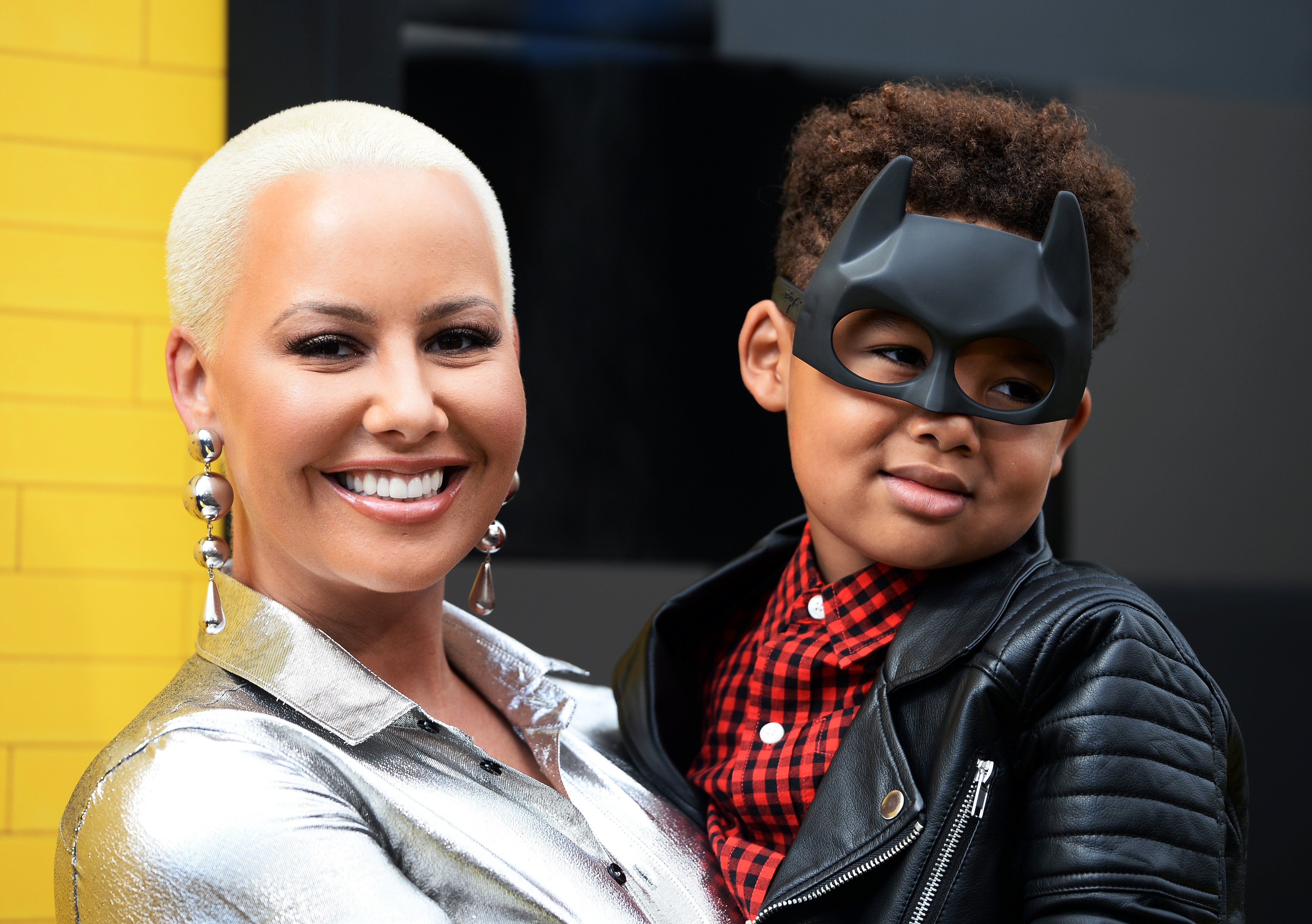 Amber Rose and Sebastian Taylor Thomaz arrive at the premiere of "The LEGO Batman Movie" at the Regency Village Theatre on February 4, 2017, in Westwood, California | Source: Getty Images