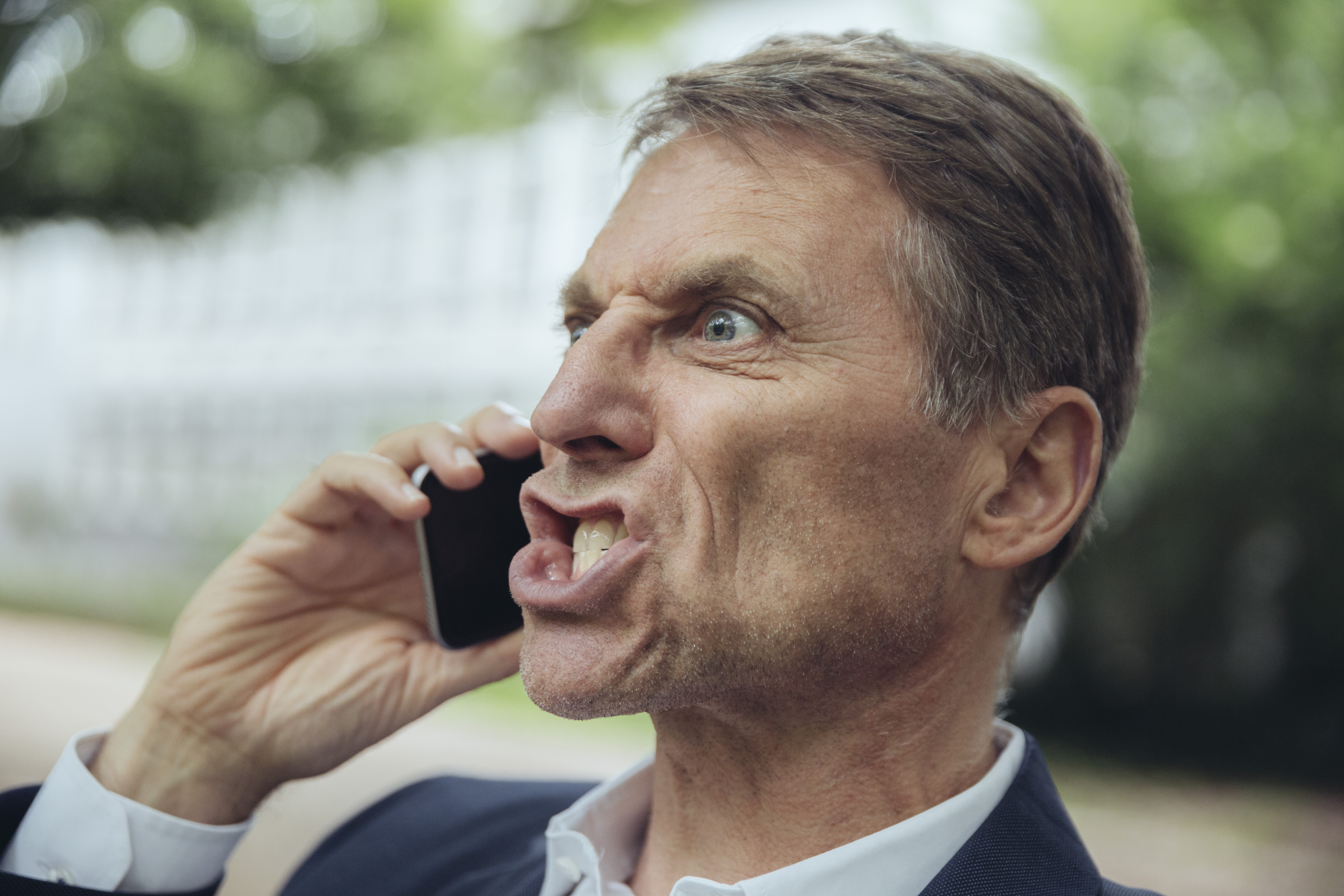 Angry mature man on the phone | Source: Getty Images