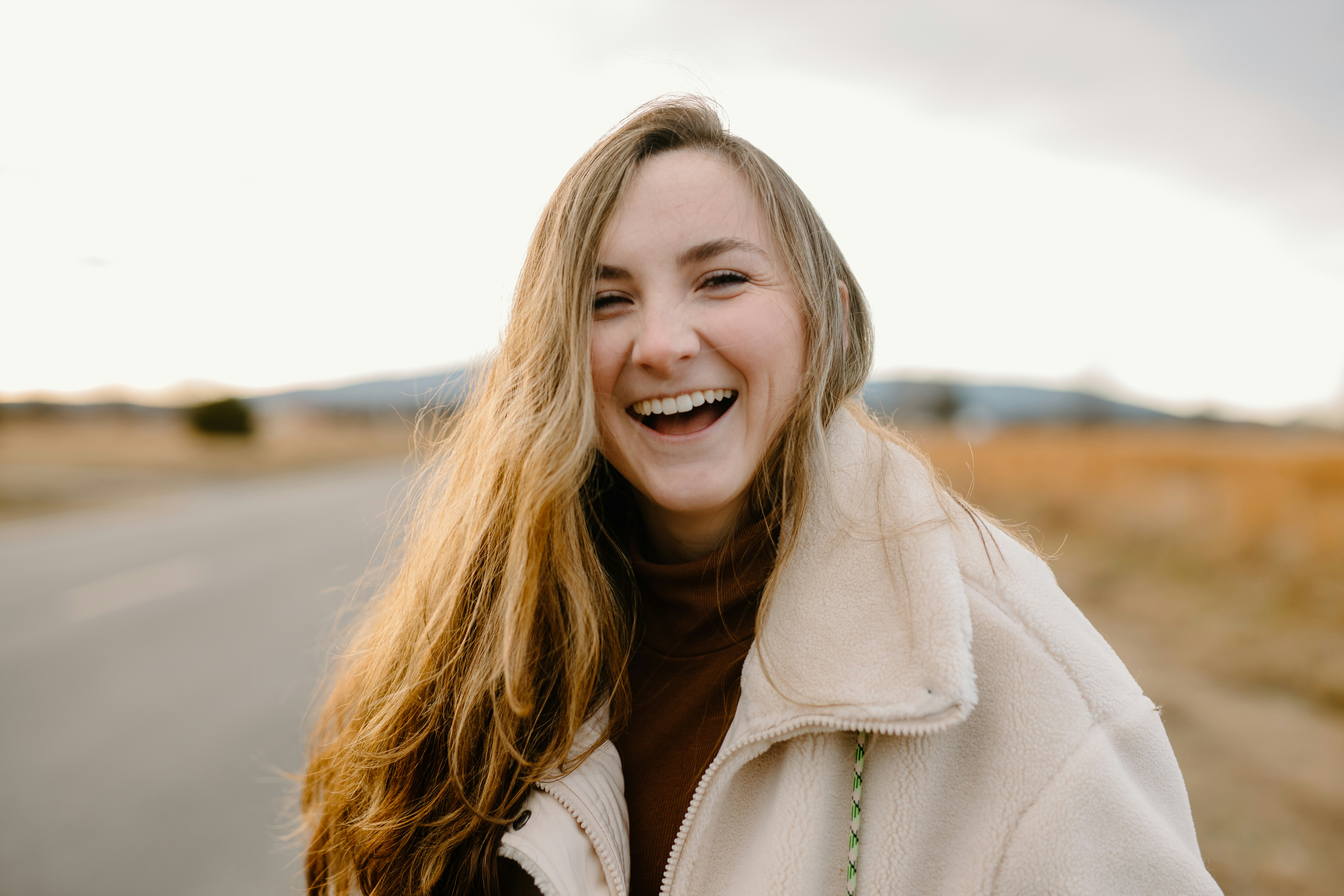 A woman laughing | Source: Unsplash