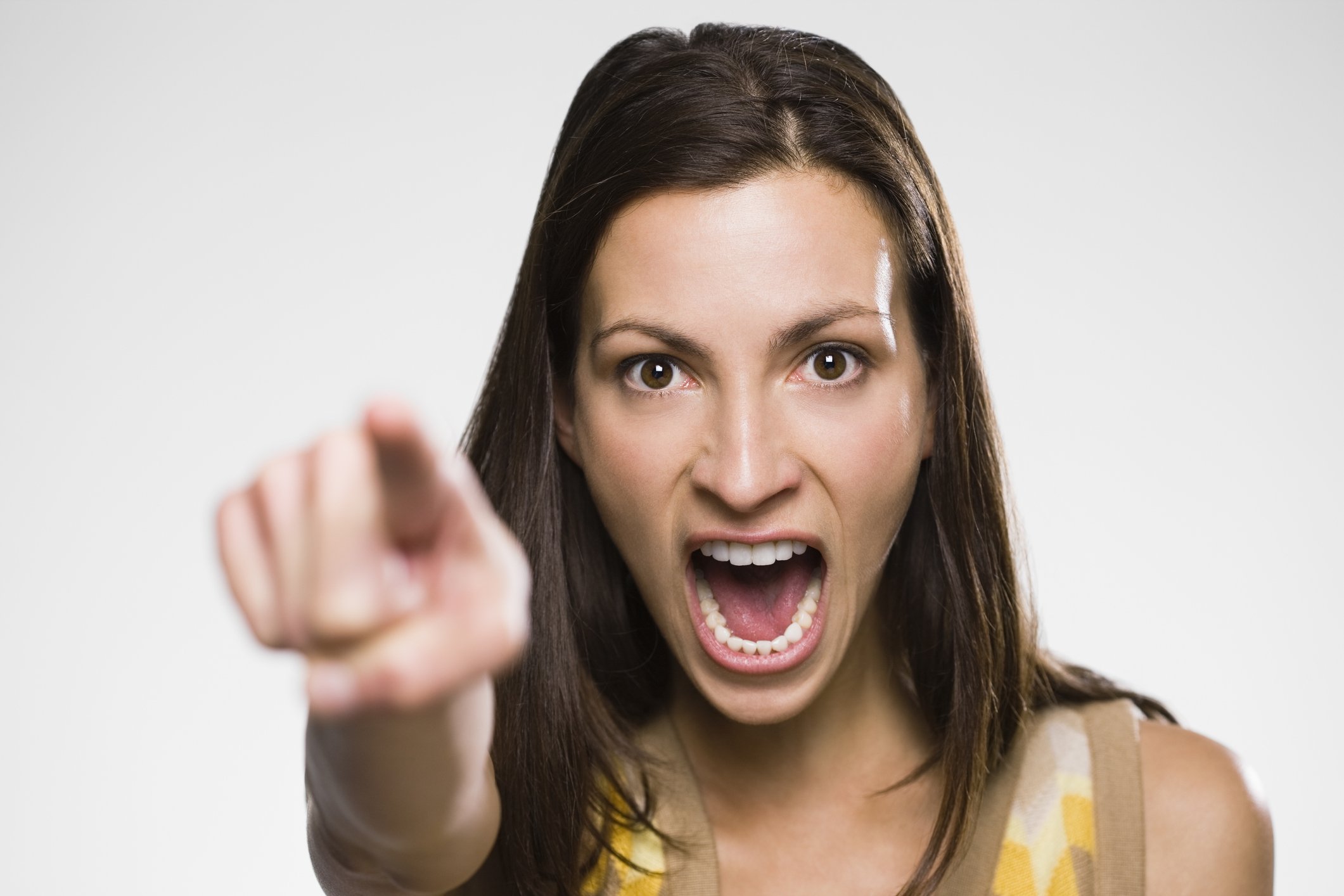 A portrait picture of a woman yelling. | Photo: Getty Images