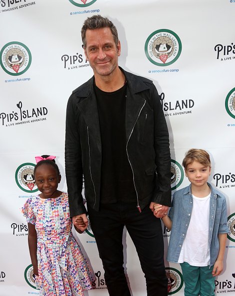 Peter Hermann with Amaya and August at the opening night celebration for "Pip's Island" Benefiting the Hole in the Wall Gang Camp on May 20, 2019. | Source: Getty Images