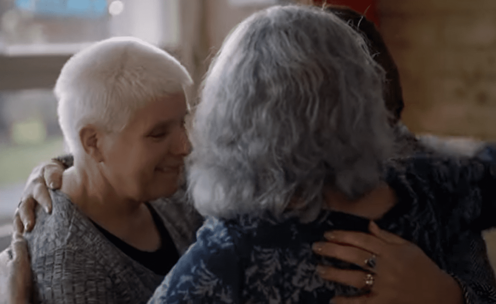 The three sister meeting for the first time and sharing an emotional embrace. | Source:  youtube.com/ITV 