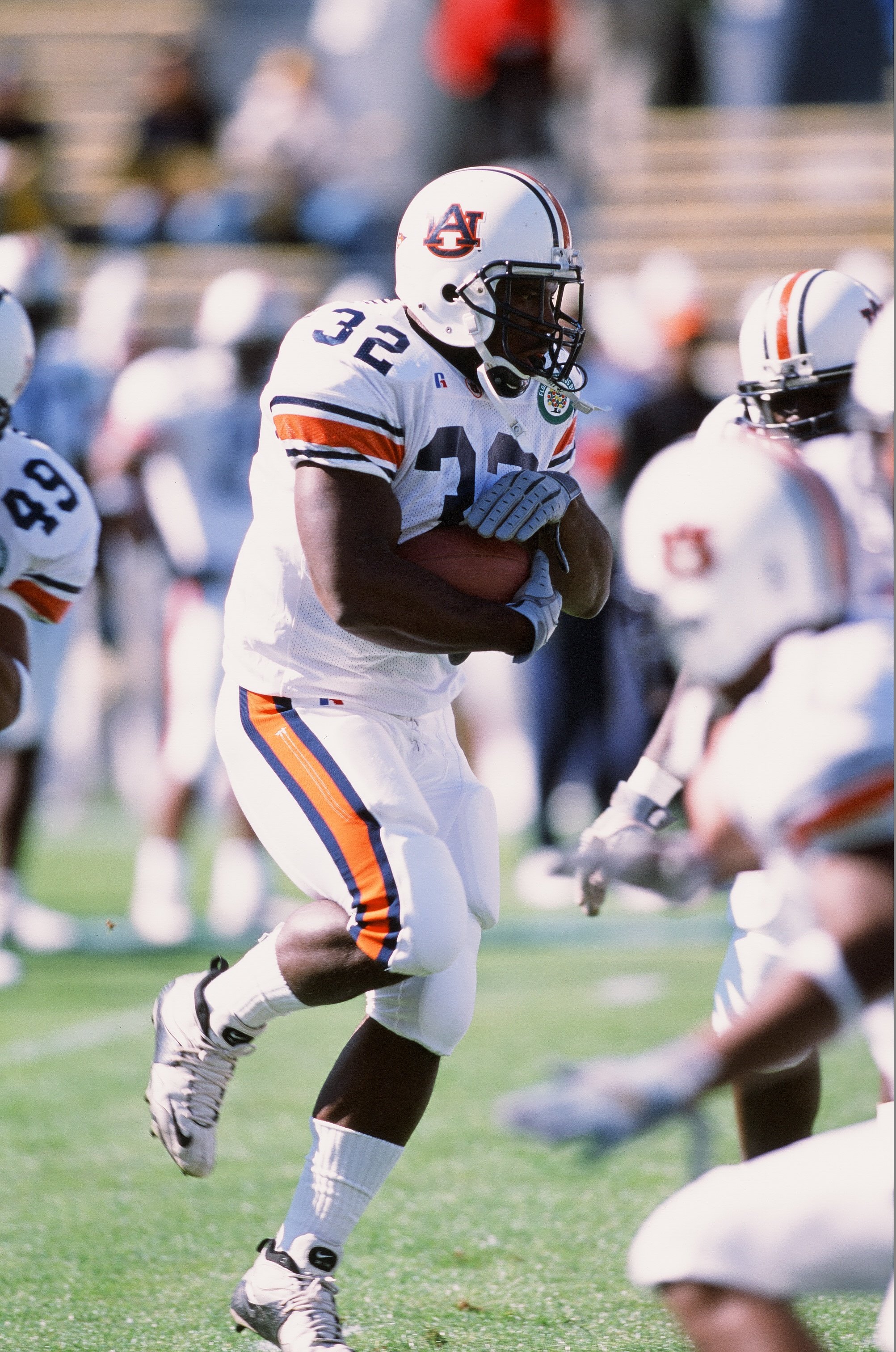 Rudi Johnson of the Auburn Tigers runs with the ball against the Michigan Wolverines on December 1, 2001 | Source: Getty Images