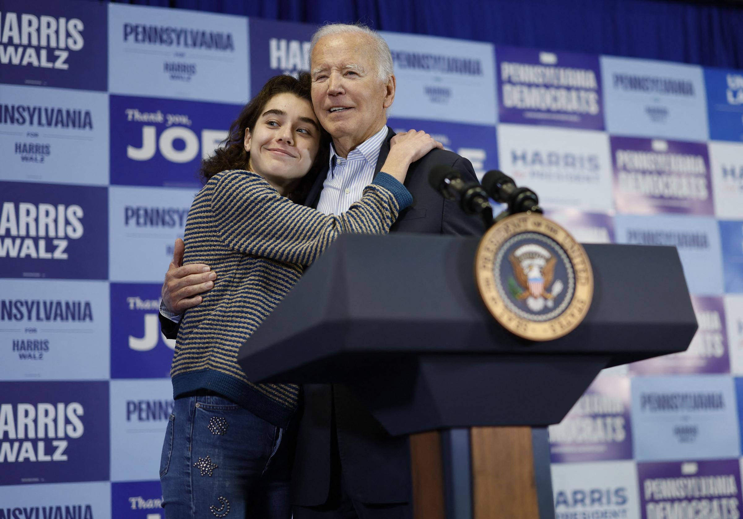US President Joe Biden hugs granddaughter at a rally | Source: Getty Images