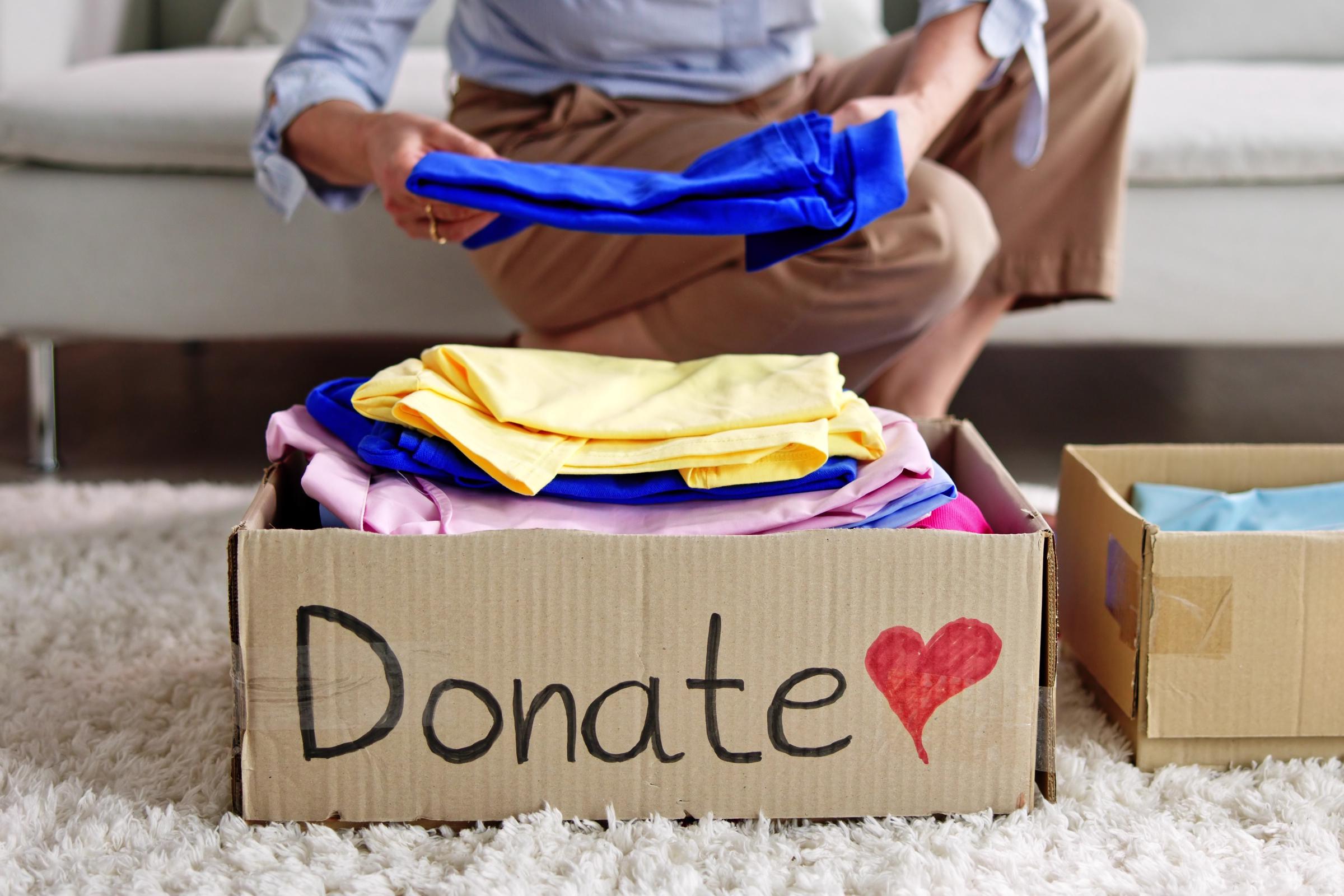 A person decluttering | Source: Shutterstock
