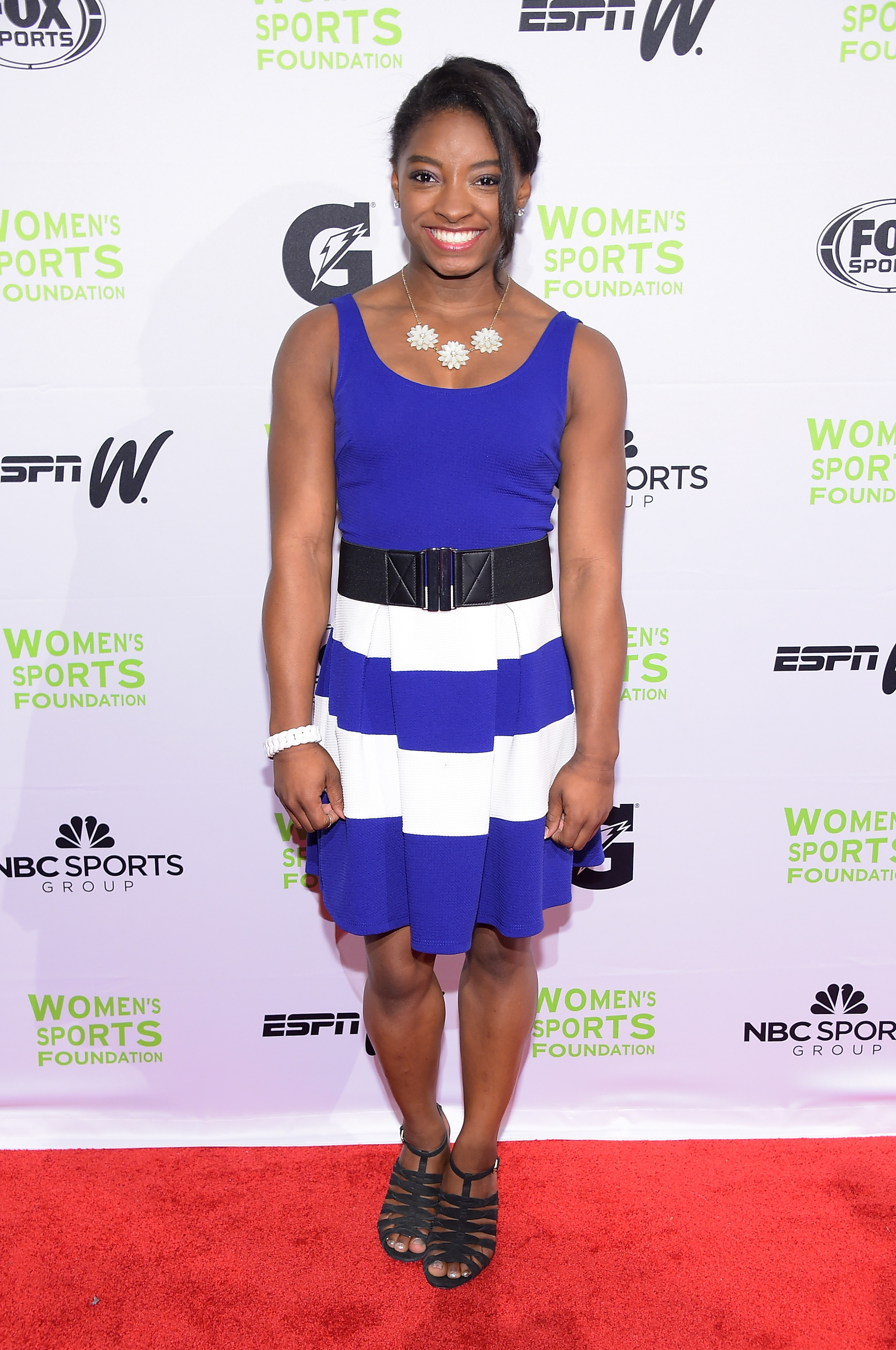Biles lights up the red carpet at the Women's Sports Foundation's 35th Annual Salute to Women in Sports awards on October 15, 2014, in New York City. The 17-year-old rising star joined athletes and advocates to celebrate women in sports and support greater access for girls across the country.