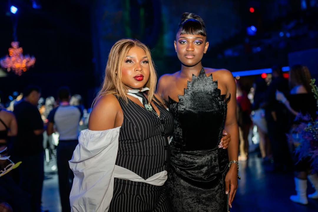 Zaya Wade poses with Calypso Jetè Balmain inside the Translatable Ball venue, where blue lighting, chandeliers, and guests create an elegant atmosphere. | Source: Instagram/translatableproject